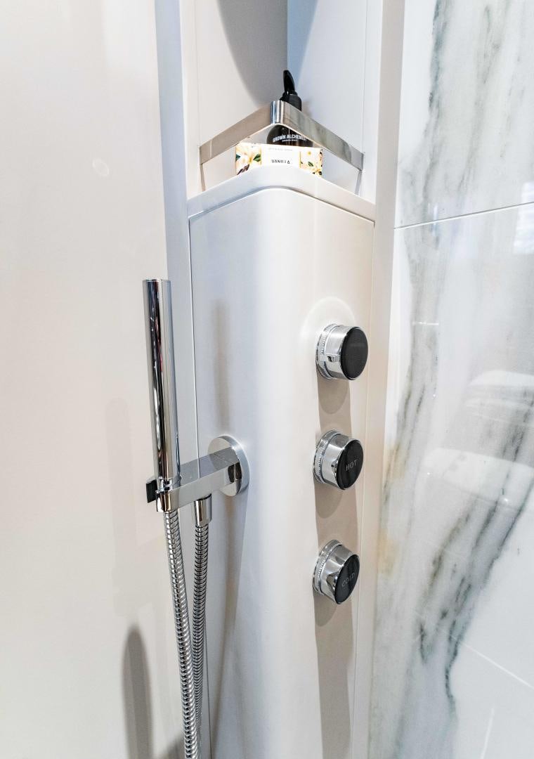 a metal door with a light on it aboard BESO Yacht for Sale