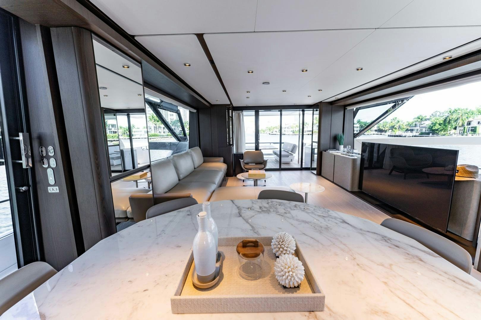 a living room with a table and chairs aboard BESO Yacht for Sale