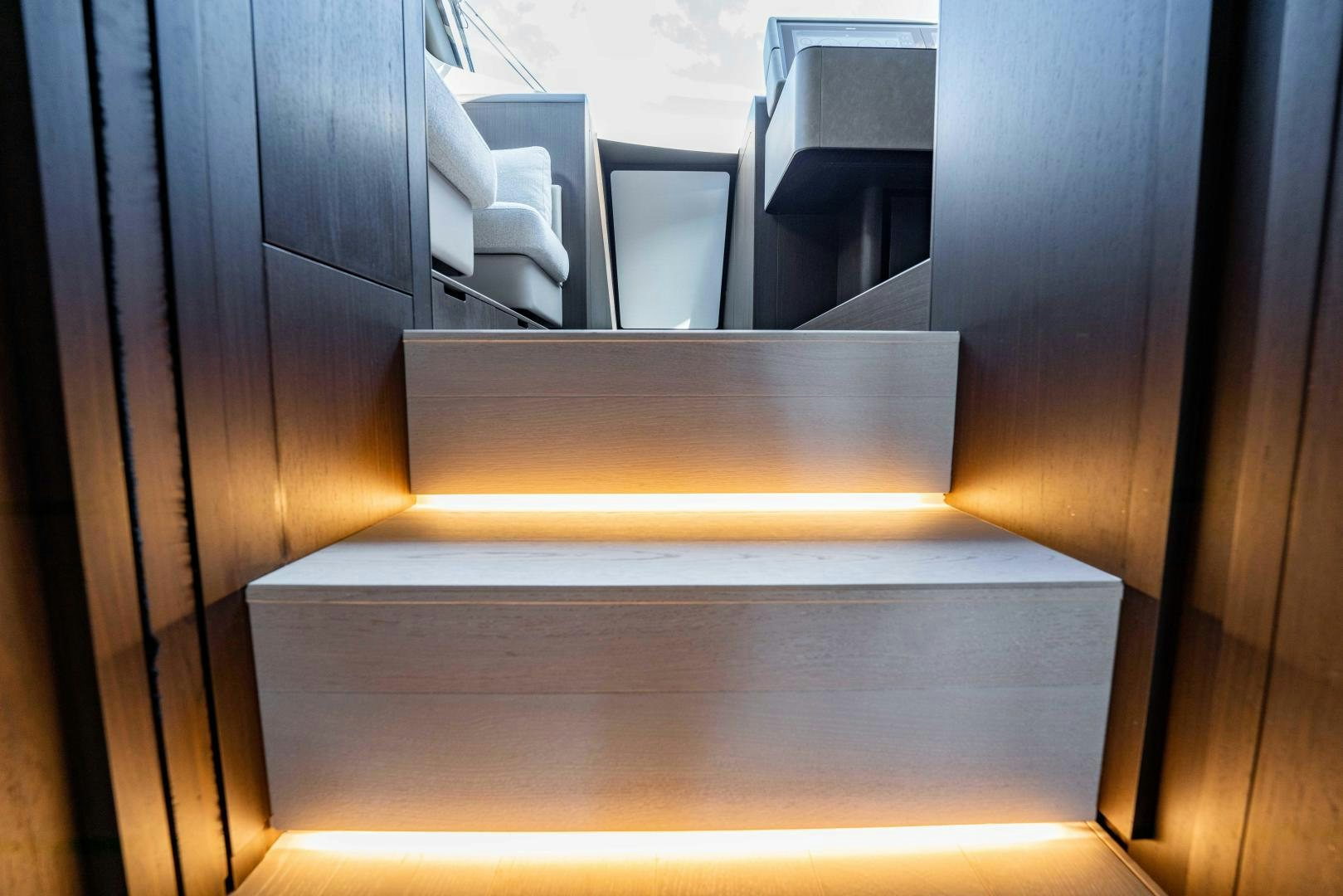 a set of stairs leading up to a room with a wood railing aboard BESO Yacht for Sale