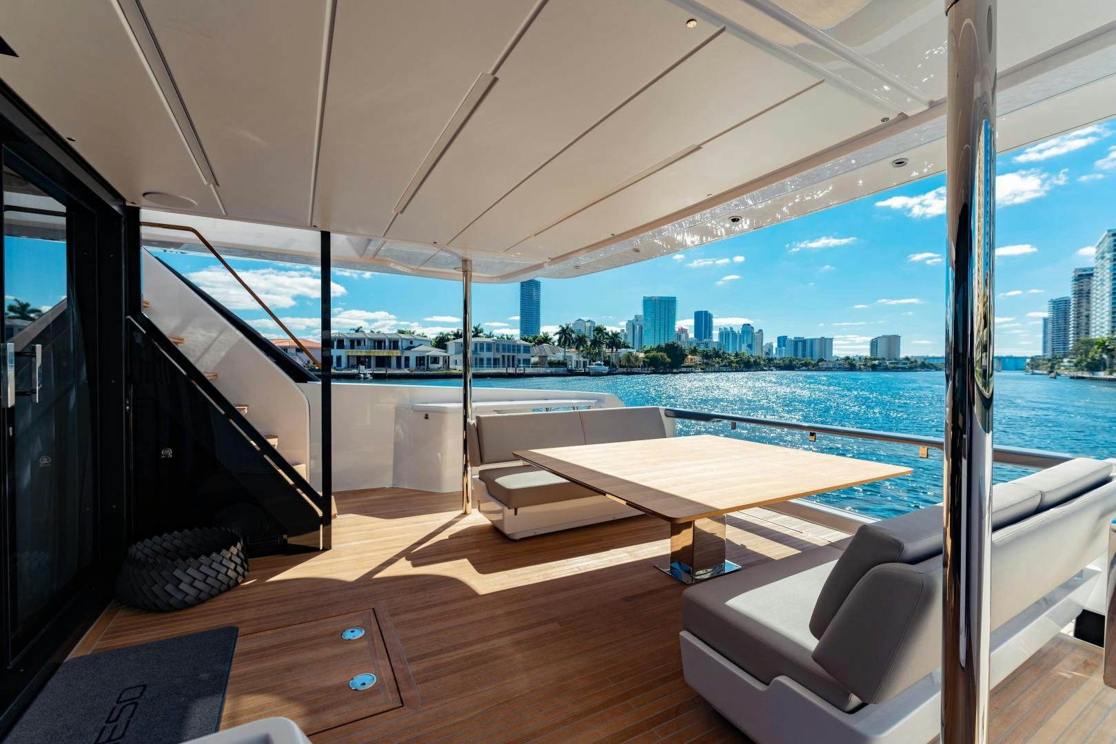 a room with a view of a city and a large body of water aboard BESO Yacht for Sale