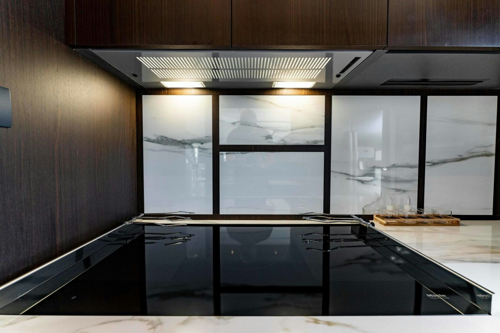 a kitchen with a glass door aboard BESO Yacht for Sale