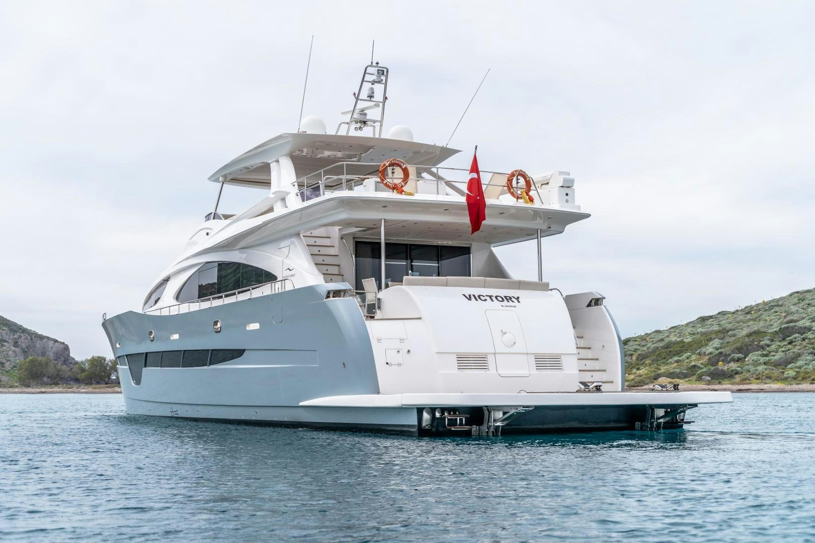 a large white boat in the water aboard VICTORY Yacht for Sale