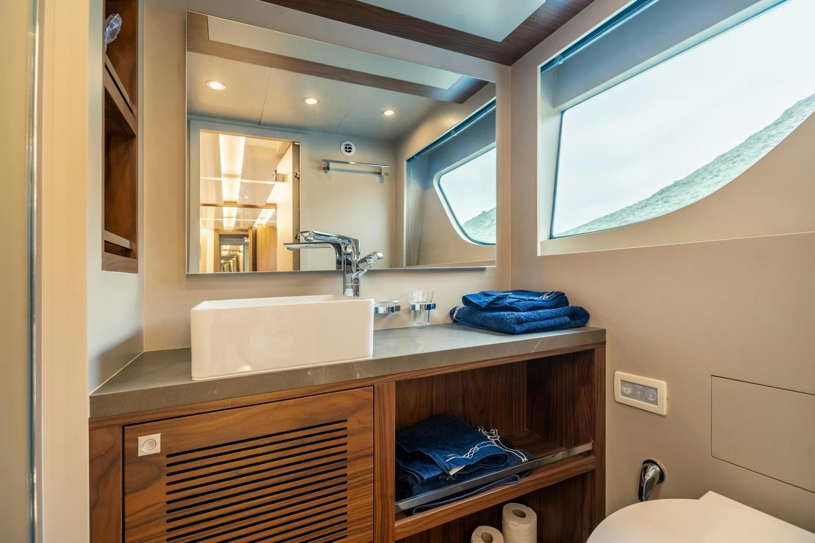 a bathroom with a large mirror aboard VICTORY Yacht for Sale