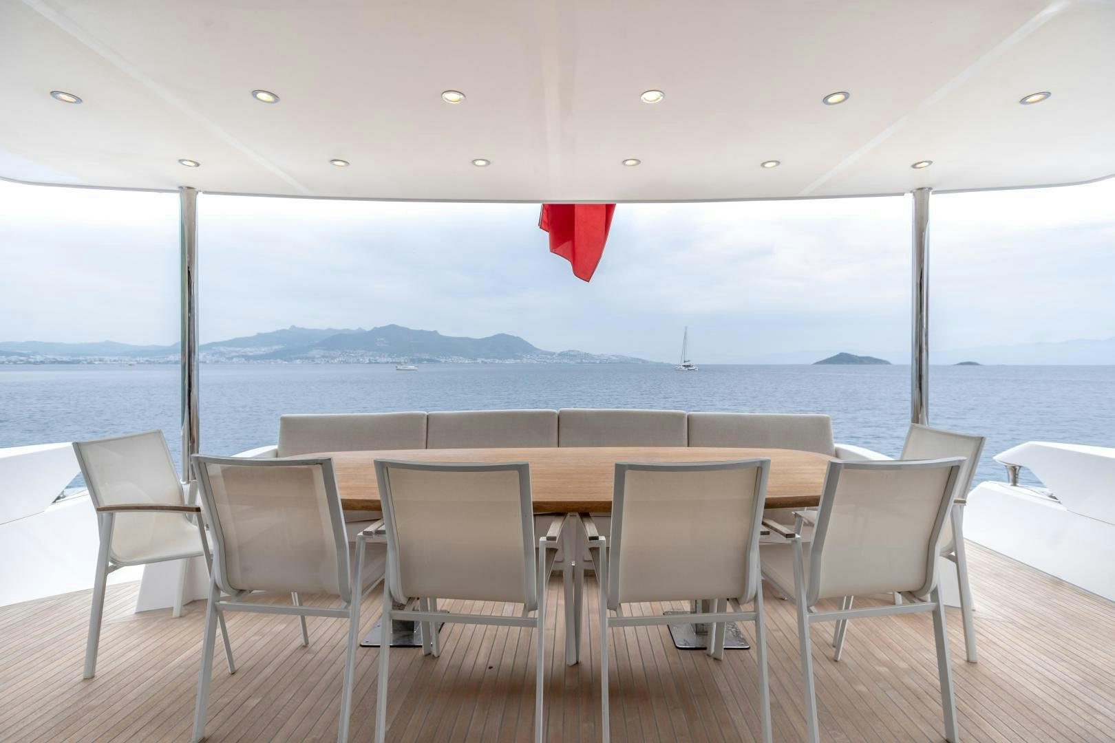 a deck with chairs and tables aboard VICTORY Yacht for Sale