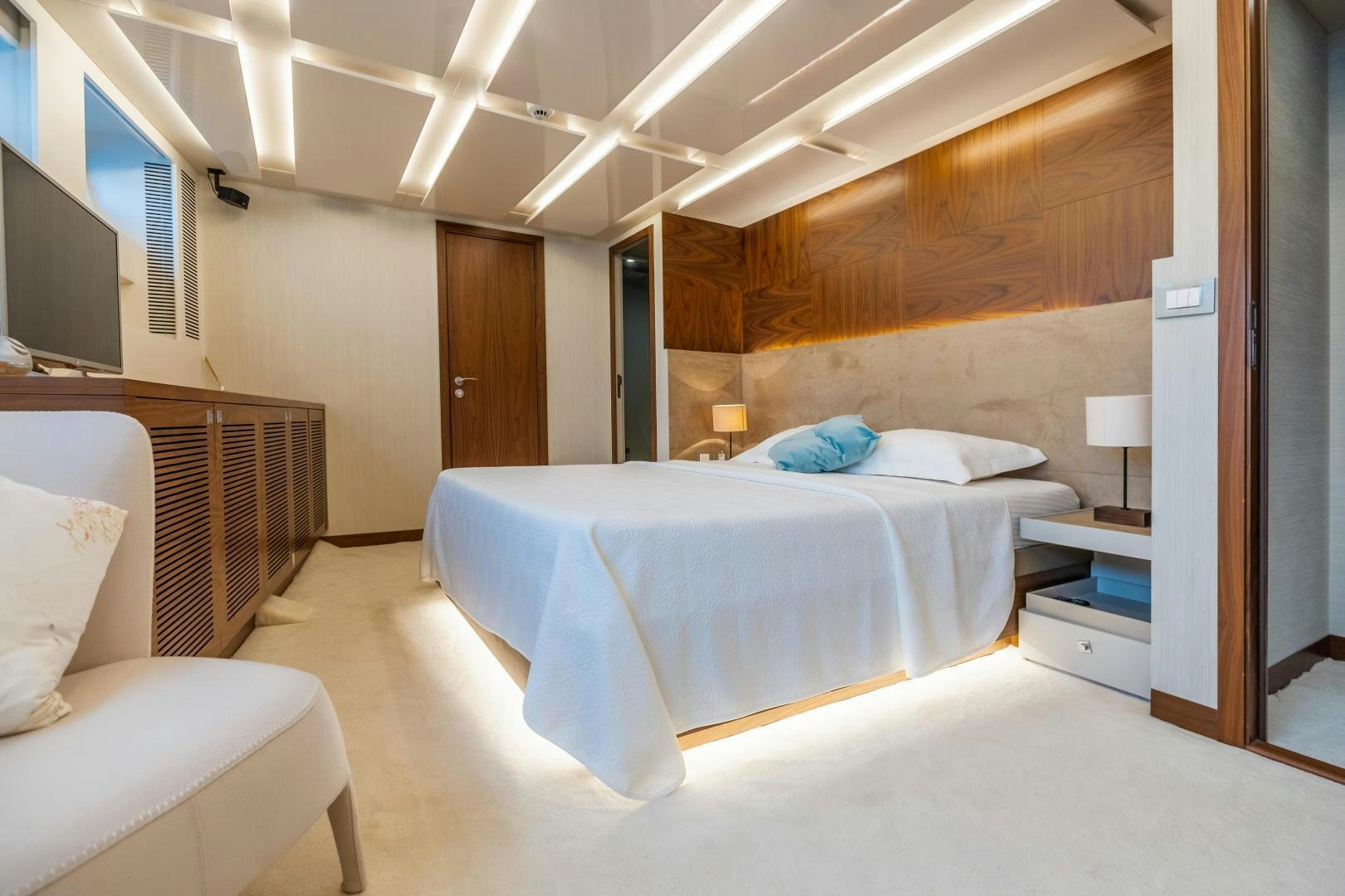 a room with a bed and a tv aboard VICTORY Yacht for Sale