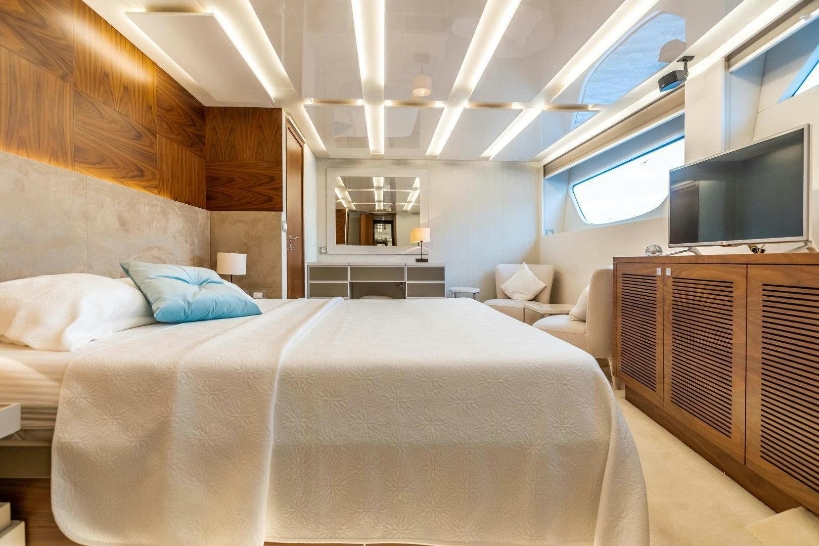 a room with a bed and a tv aboard VICTORY Yacht for Sale