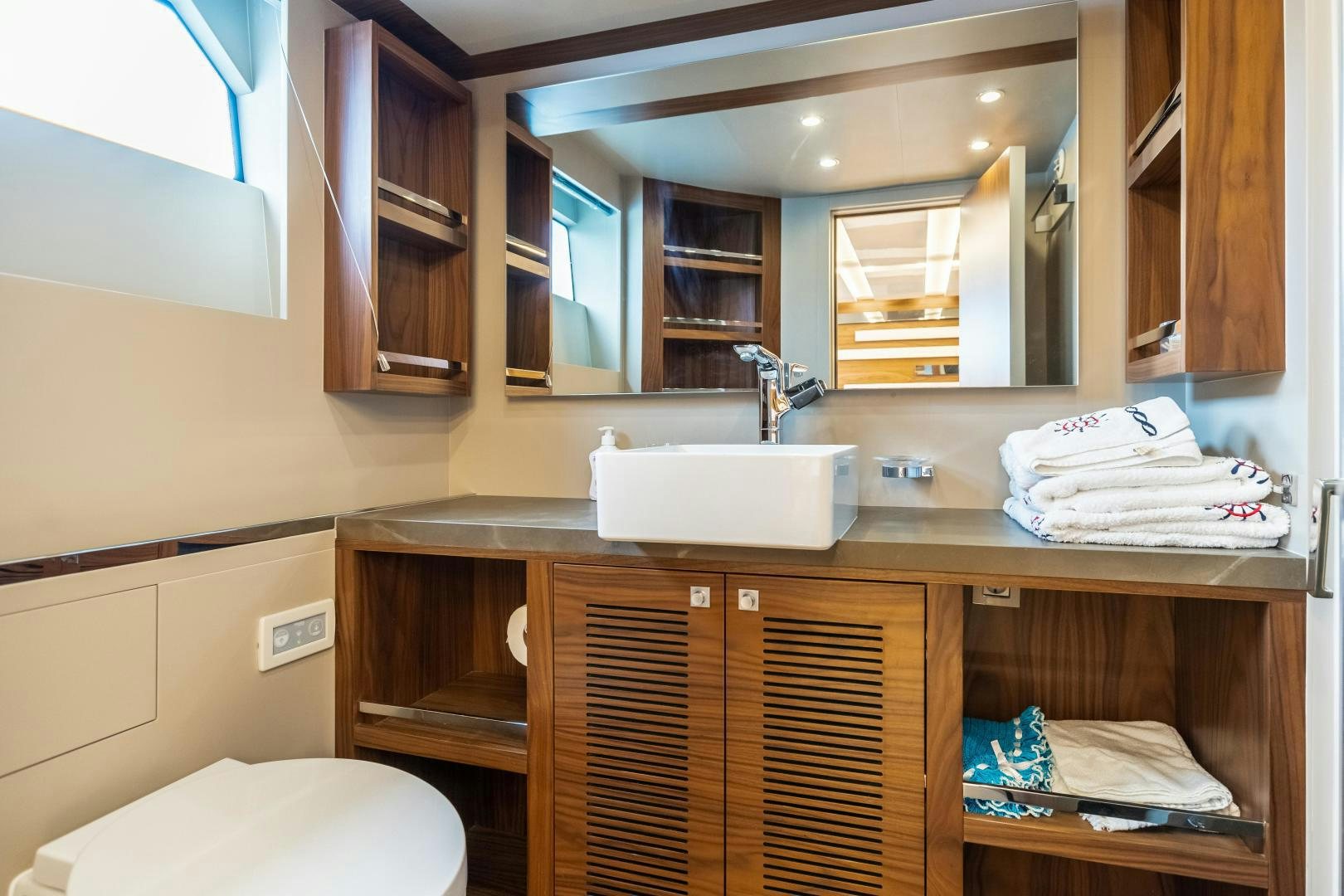 a bathroom with a sink and cabinets aboard VICTORY Yacht for Sale
