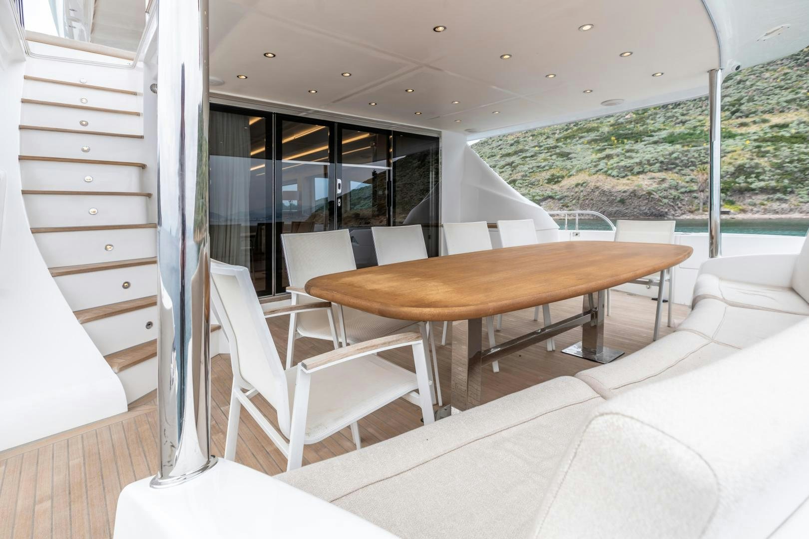 a room with a table and chairs aboard VICTORY Yacht for Sale