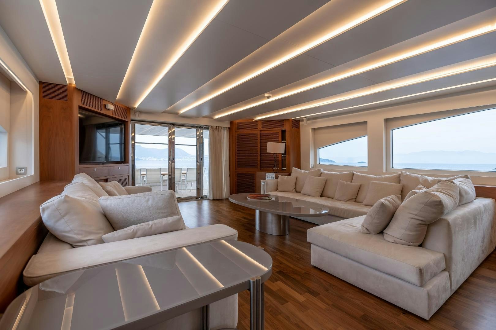 a living room with a couch and a table aboard VICTORY Yacht for Sale