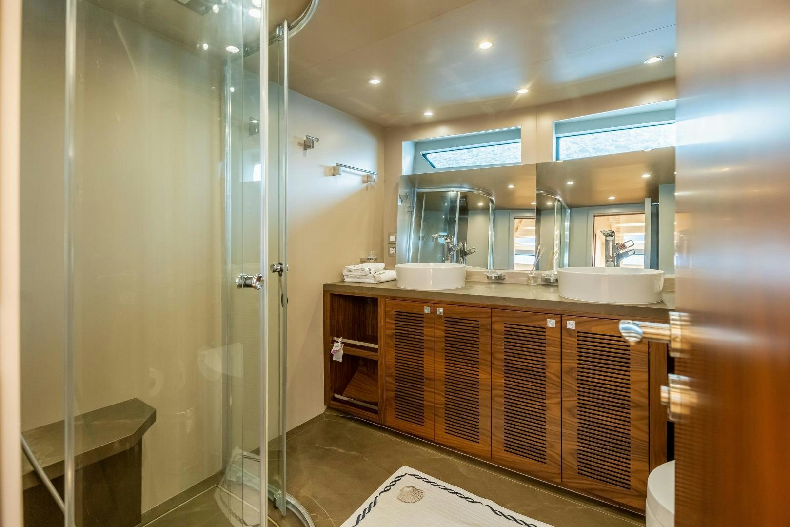 a bathroom with a large mirror aboard VICTORY Yacht for Sale