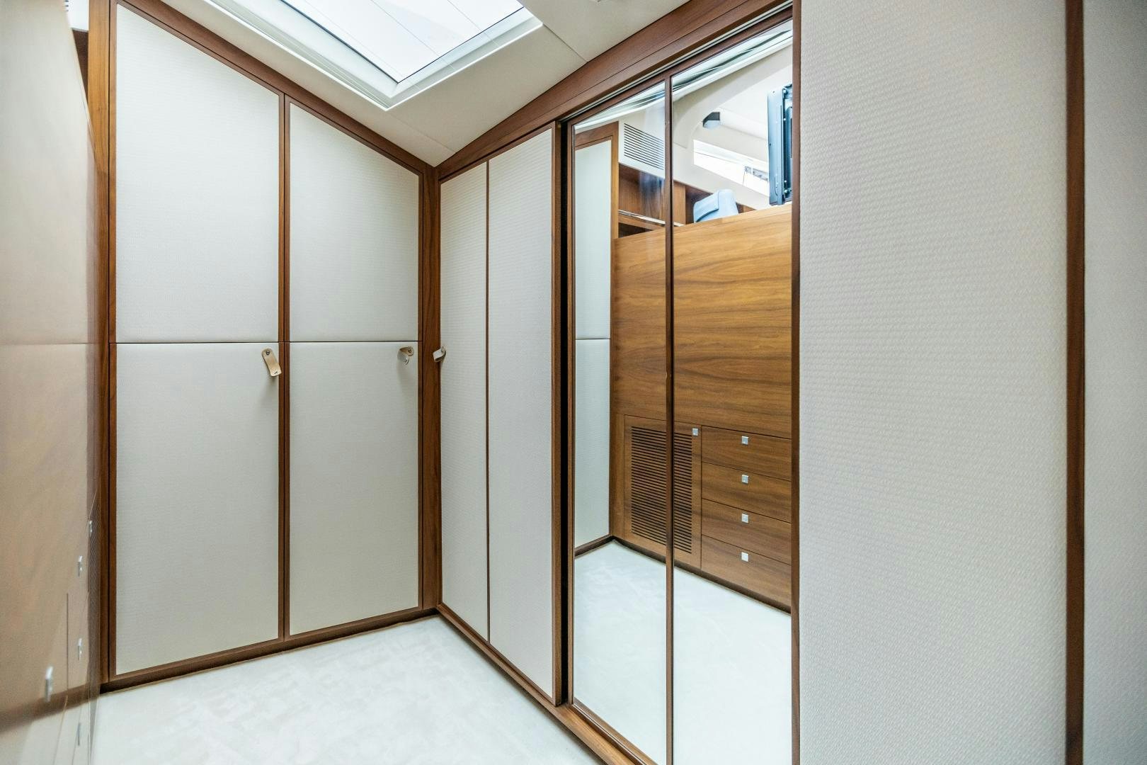 a room with a closet and a door aboard VICTORY Yacht for Sale