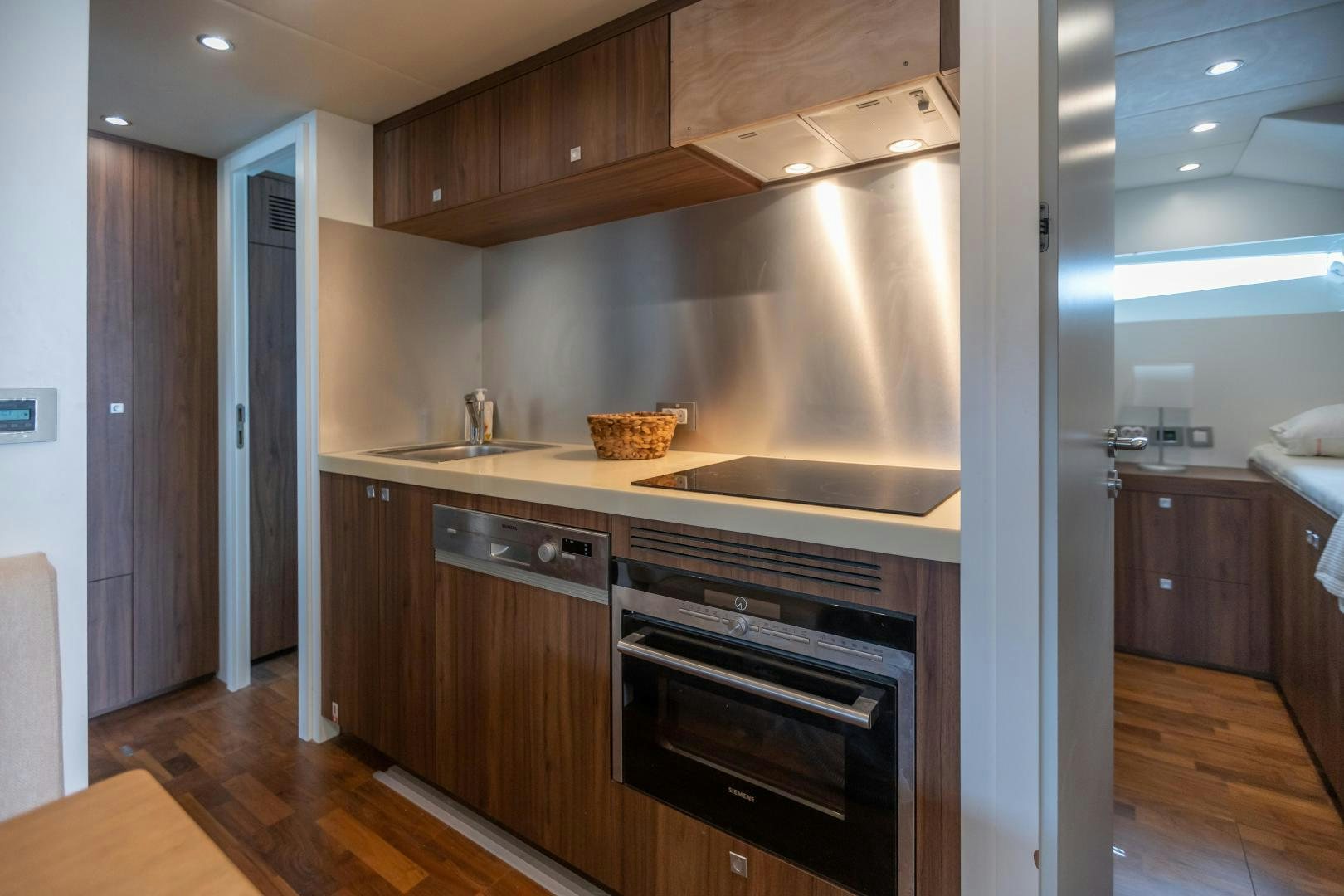 a kitchen with a stainless steel oven aboard VICTORY Yacht for Sale