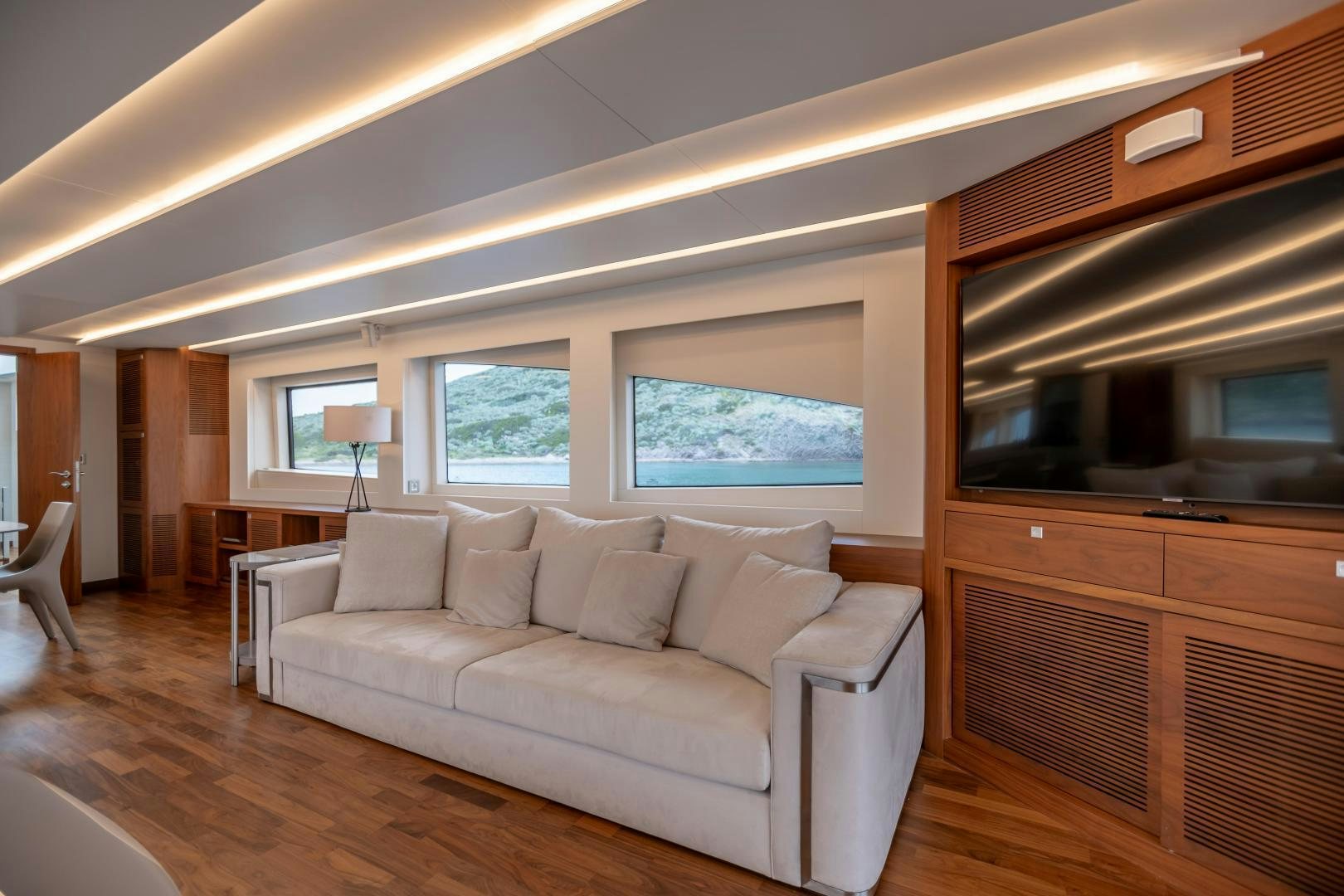 a living room with a couch and a television aboard VICTORY Yacht for Sale