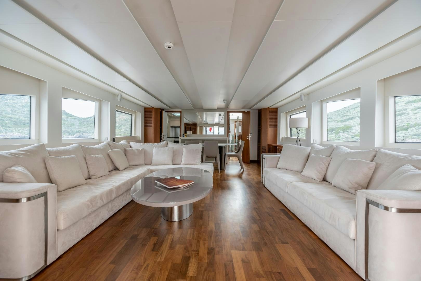 a living room with a large sofa aboard VICTORY Yacht for Sale