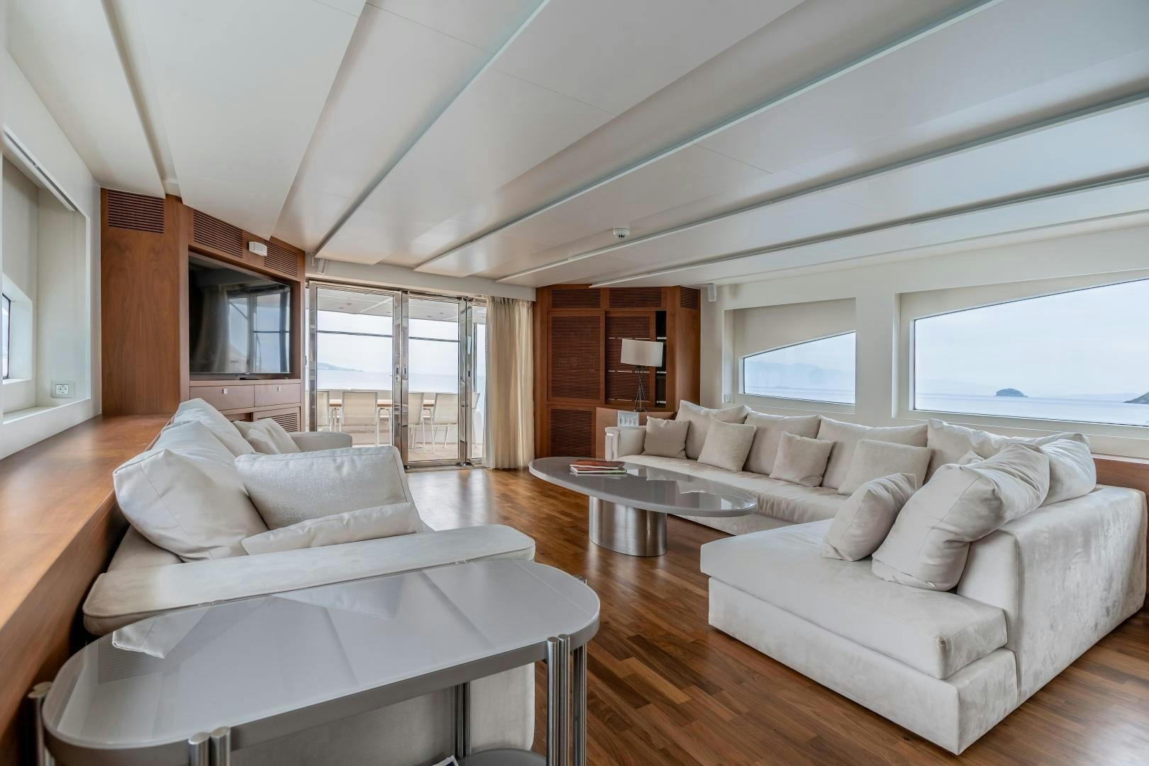 a living room with a couch and a table aboard VICTORY Yacht for Sale