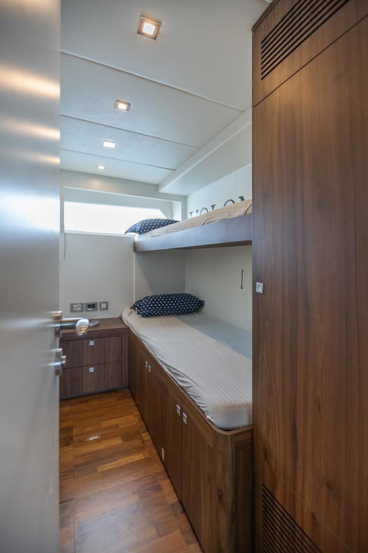 a small bedroom with a bed aboard VICTORY Yacht for Sale