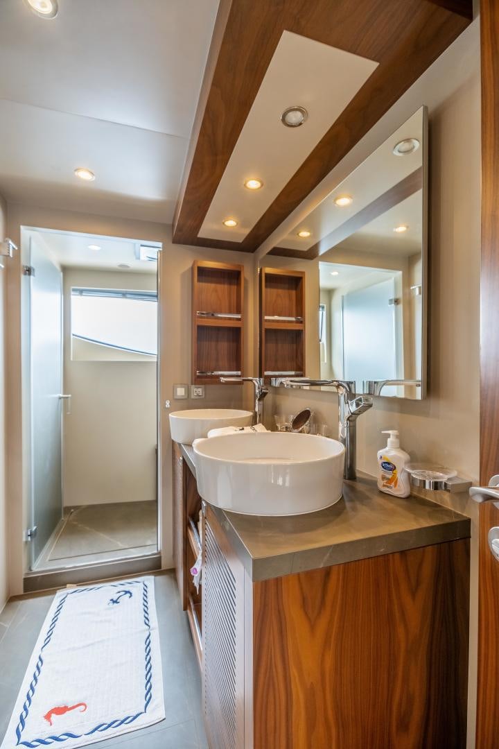 a bathroom with a sink and a mirror aboard VICTORY Yacht for Sale