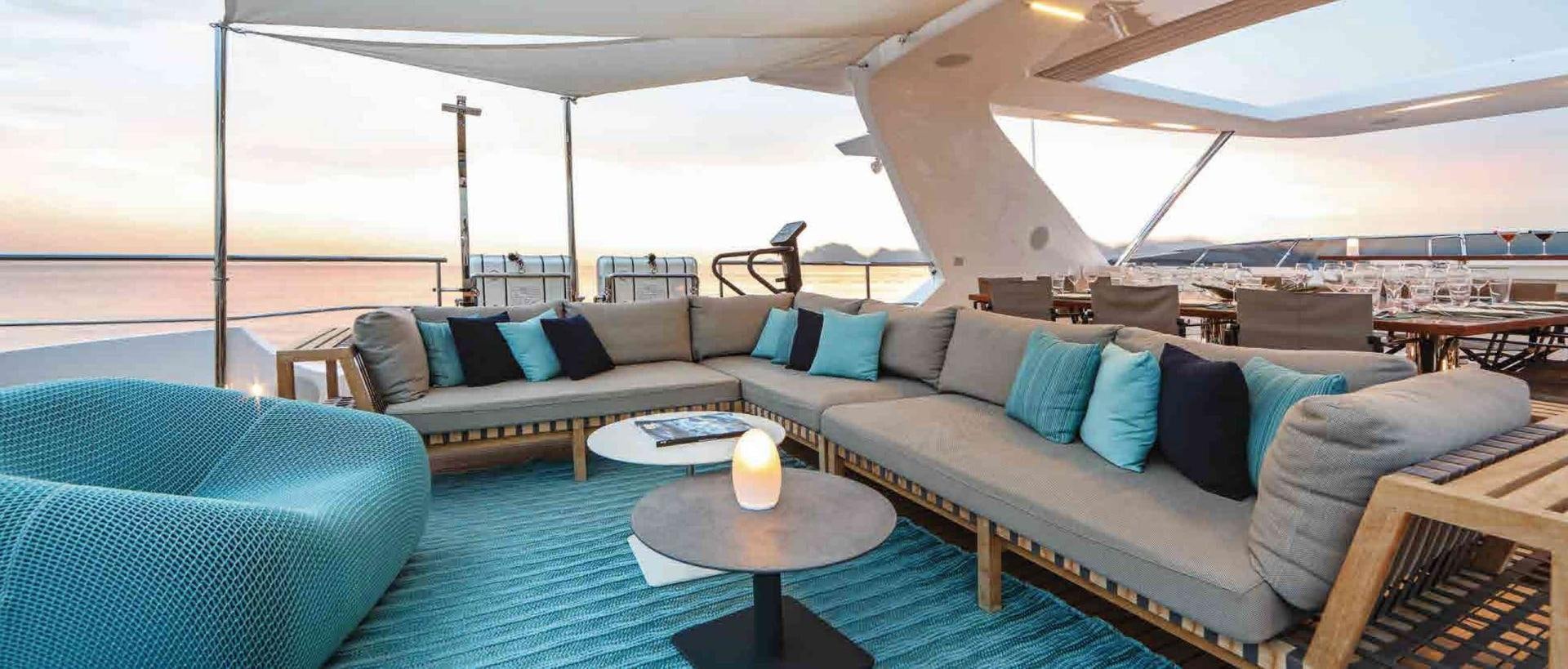 a large living room with a couch and a table aboard COFINA Yacht for Sale
