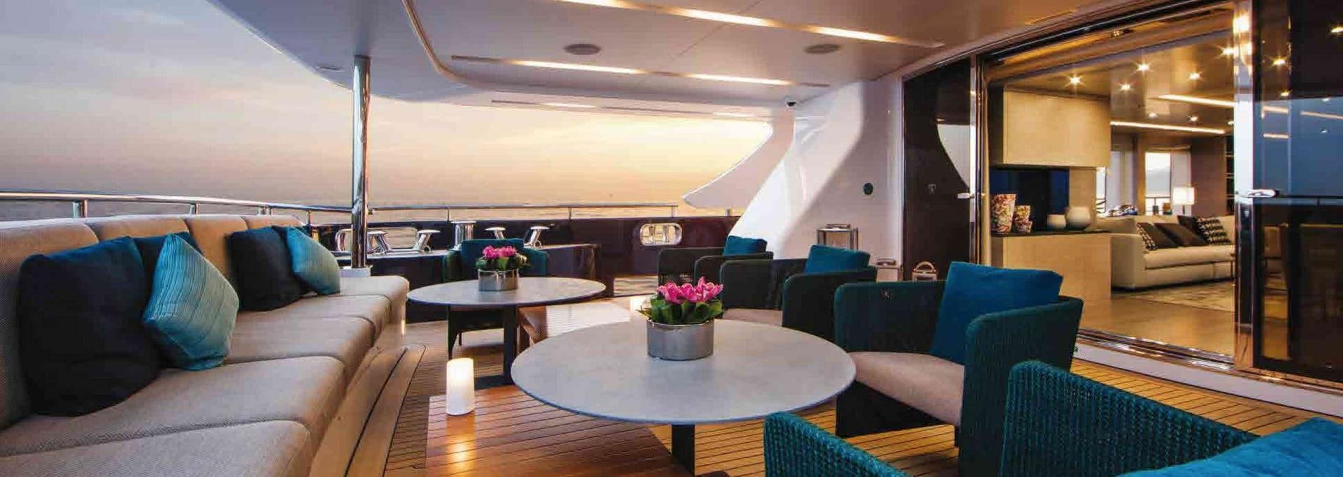 a living room with a couch and a table aboard COFINA Yacht for Sale