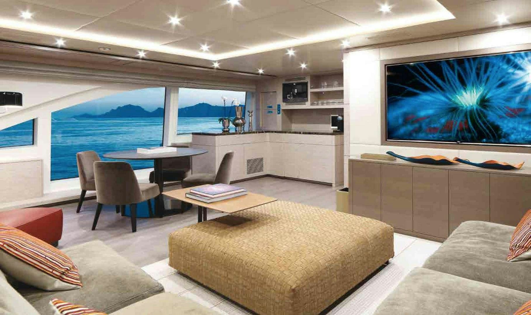 a living room with a large window aboard COFINA Yacht for Sale