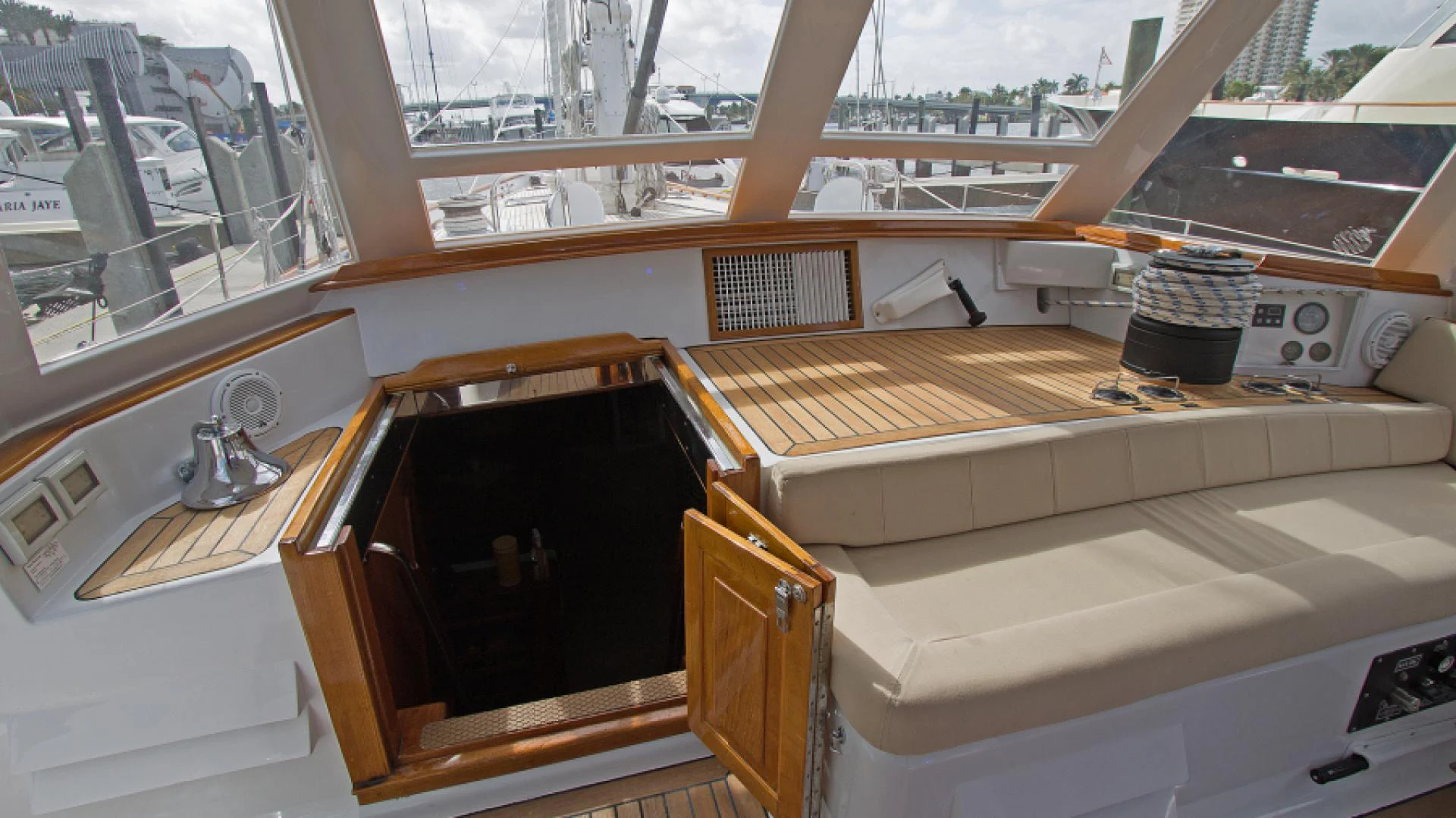 a room with a wood floor and a window with a wood cabinet aboard EAGLE'S NEST Yacht for Sale