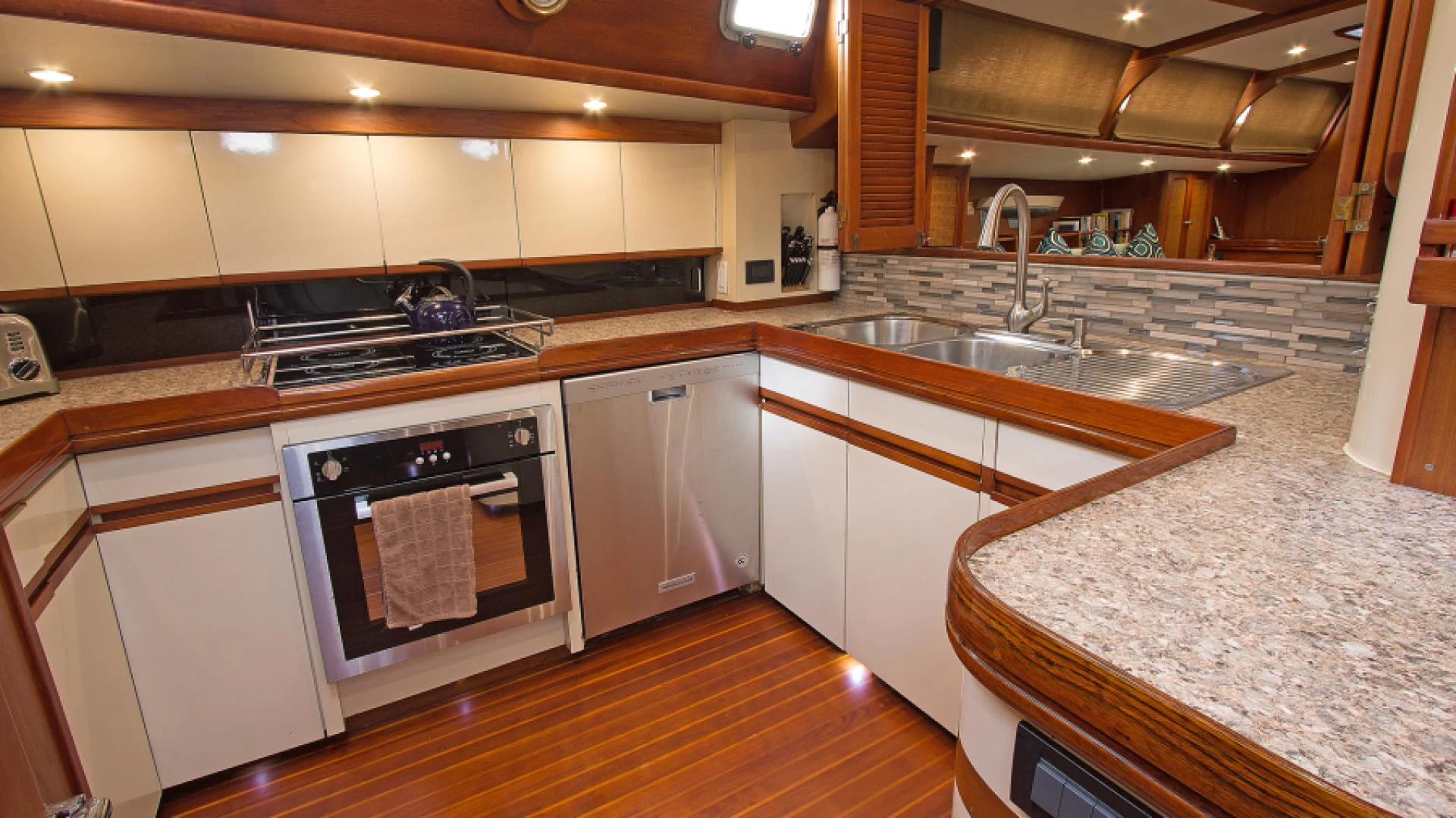 a kitchen with a stove and sink aboard EAGLE'S NEST Yacht for Sale