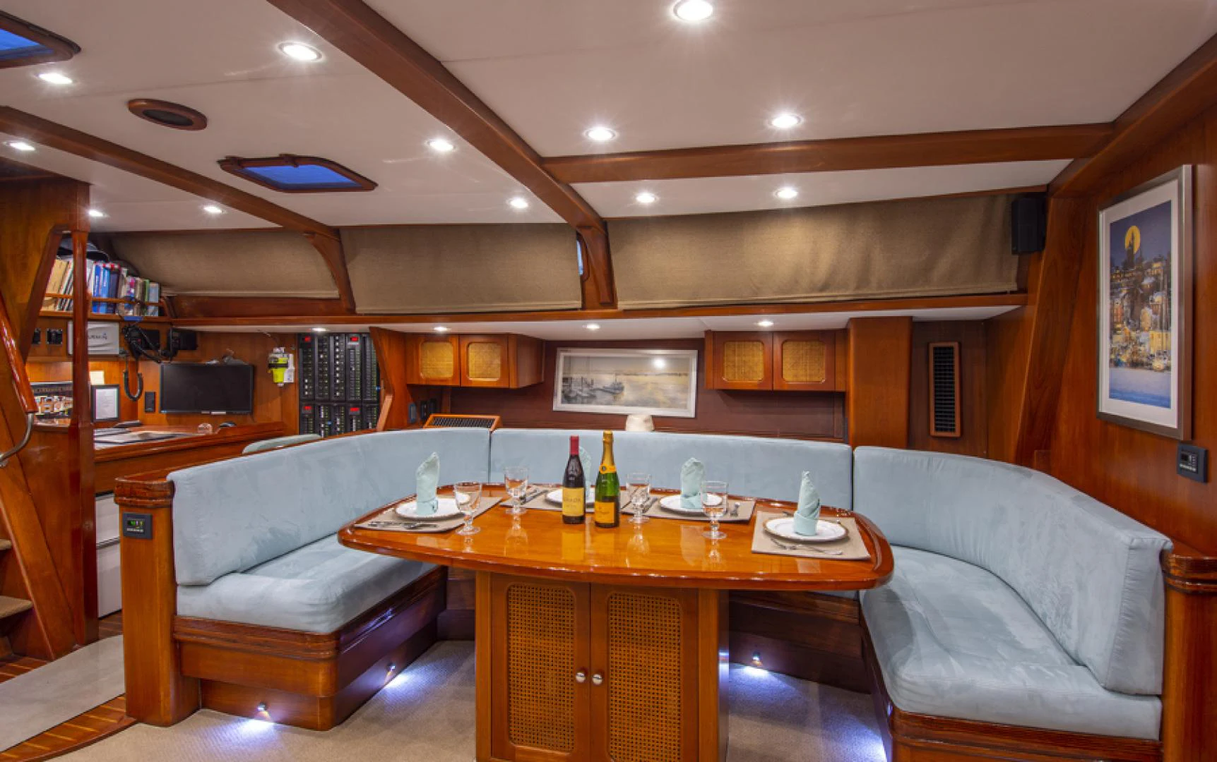 a room with a couch and a table and a tv aboard EAGLE'S NEST Yacht for Sale