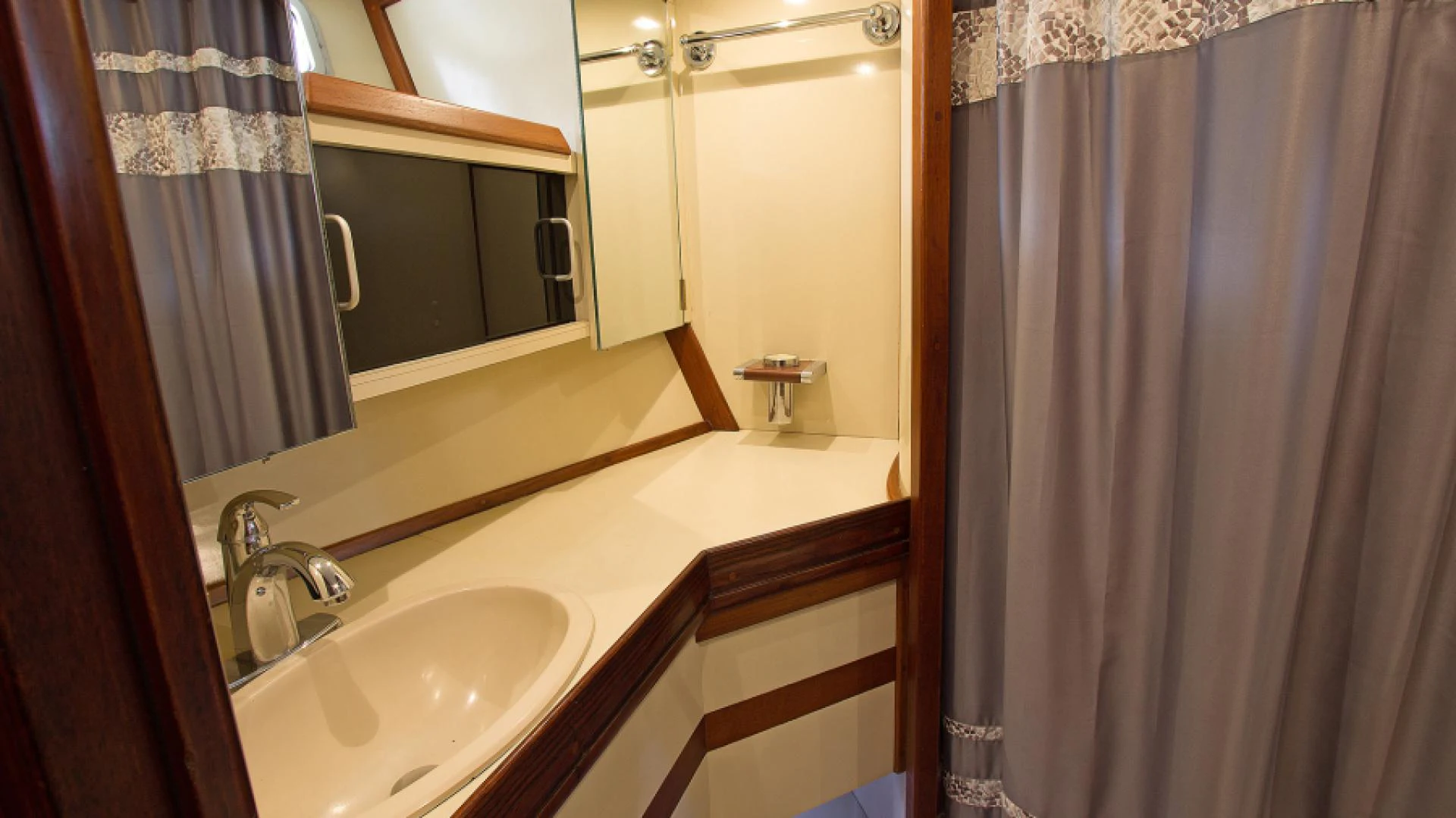 a bathroom with a sink and a mirror aboard EAGLE'S NEST Yacht for Sale