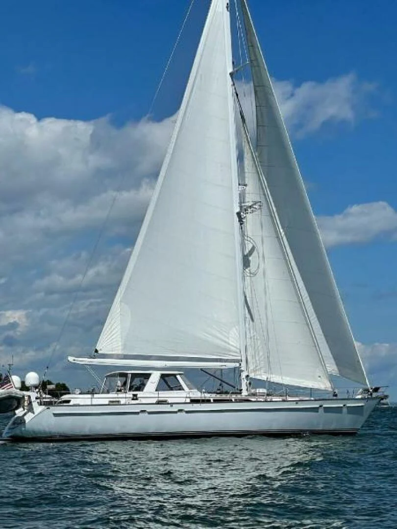 a white sailboat on the water aboard EAGLE'S NEST Yacht for Sale