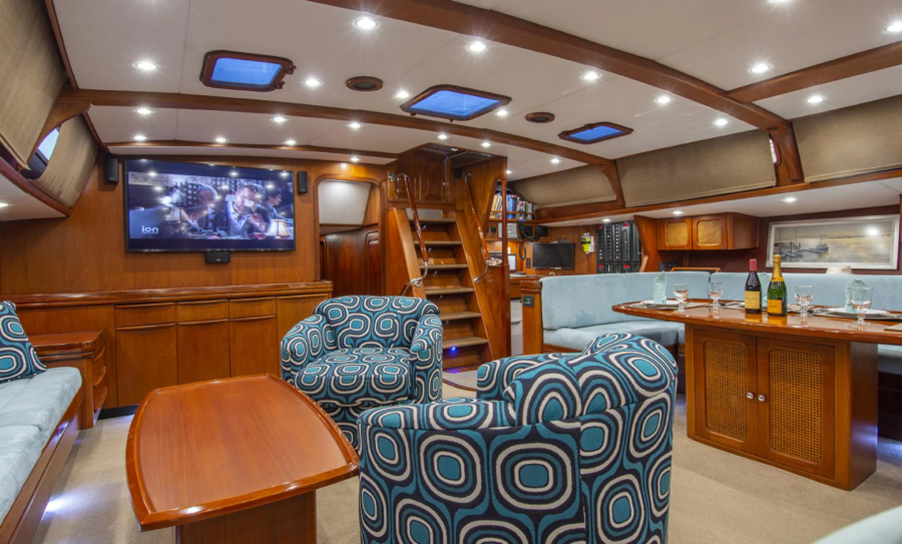 a room with a couch and a tv aboard EAGLE'S NEST Yacht for Sale