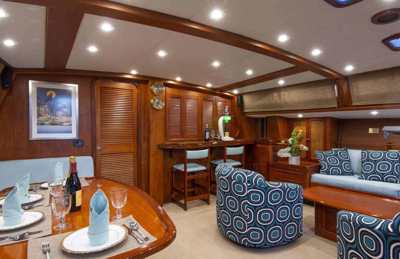 a living room with a table and chairs aboard EAGLE'S NEST Yacht for Sale