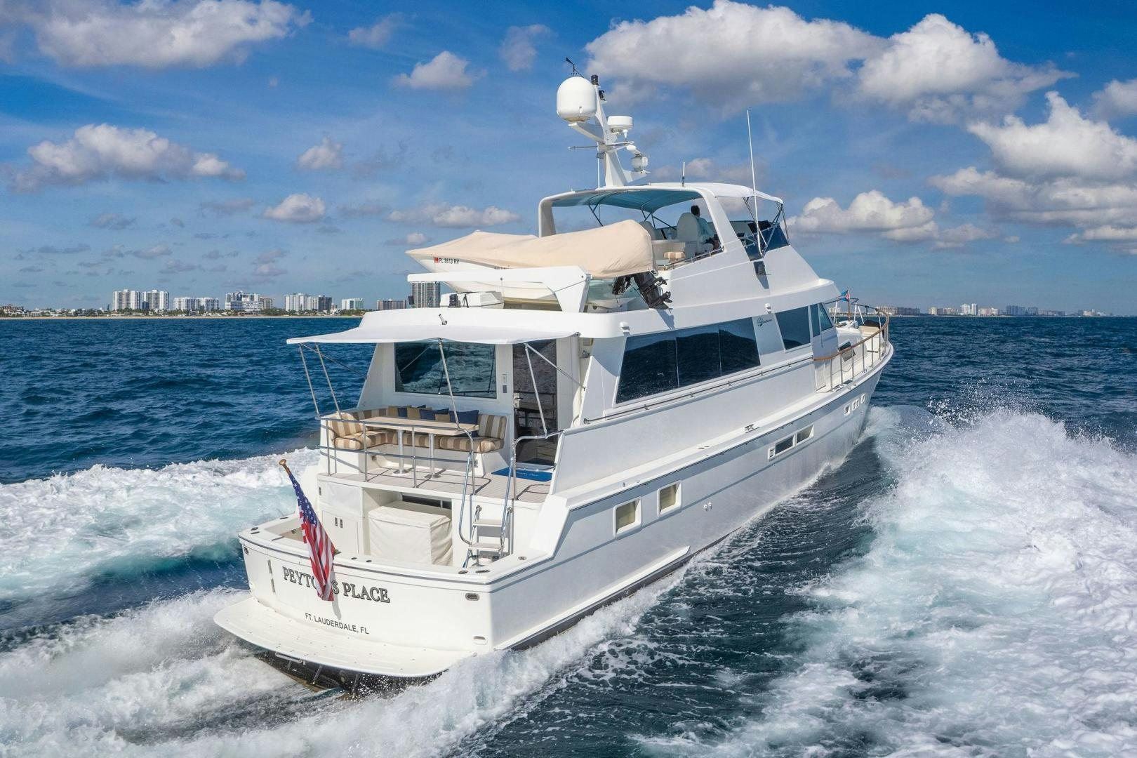 a white boat on the water aboard PEYTONS PLACE Yacht for Sale