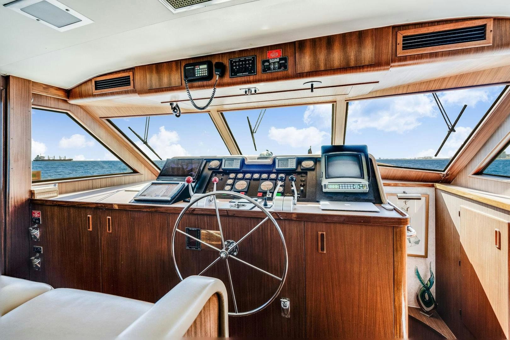 a boat with a desk and a laptop on it aboard PEYTONS PLACE Yacht for Sale