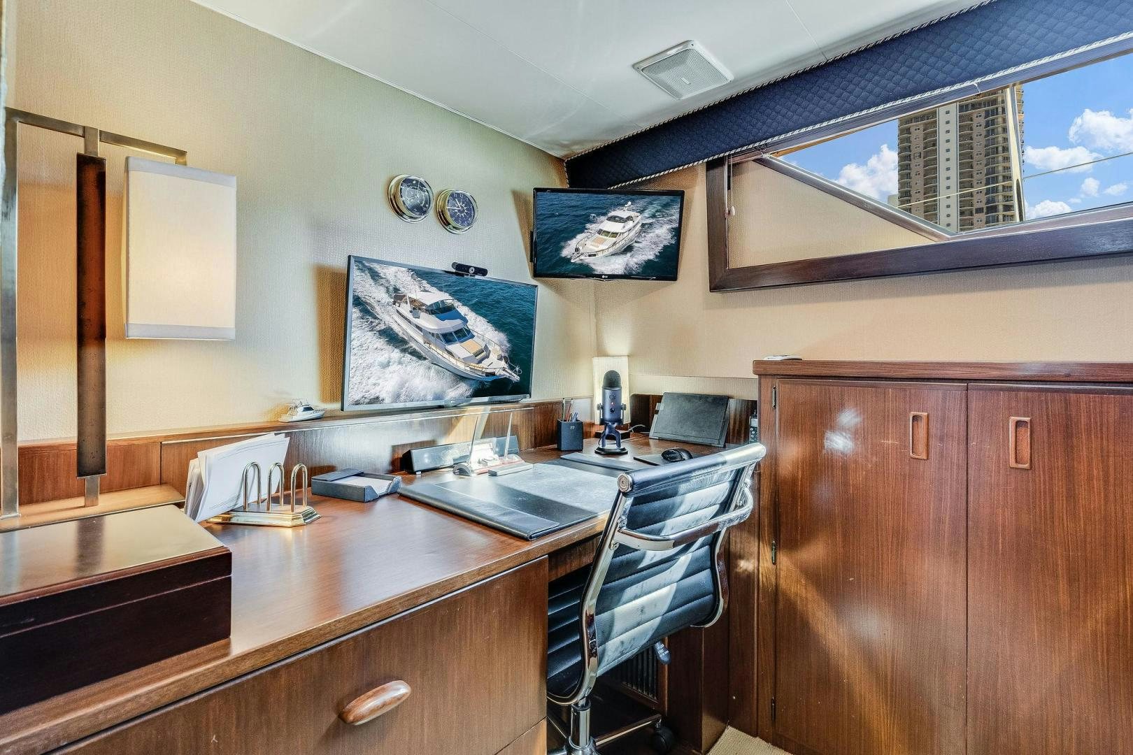 a kitchen with a large window aboard PEYTONS PLACE Yacht for Sale
