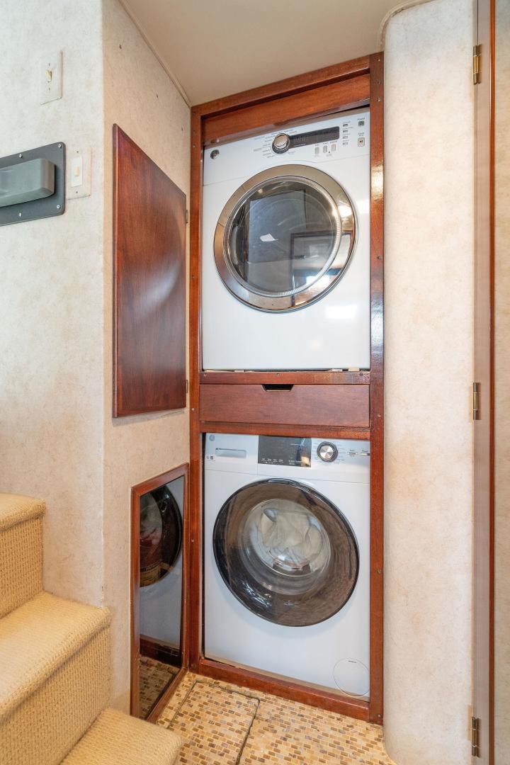 a washer and dryer in a room aboard PEYTONS PLACE Yacht for Sale