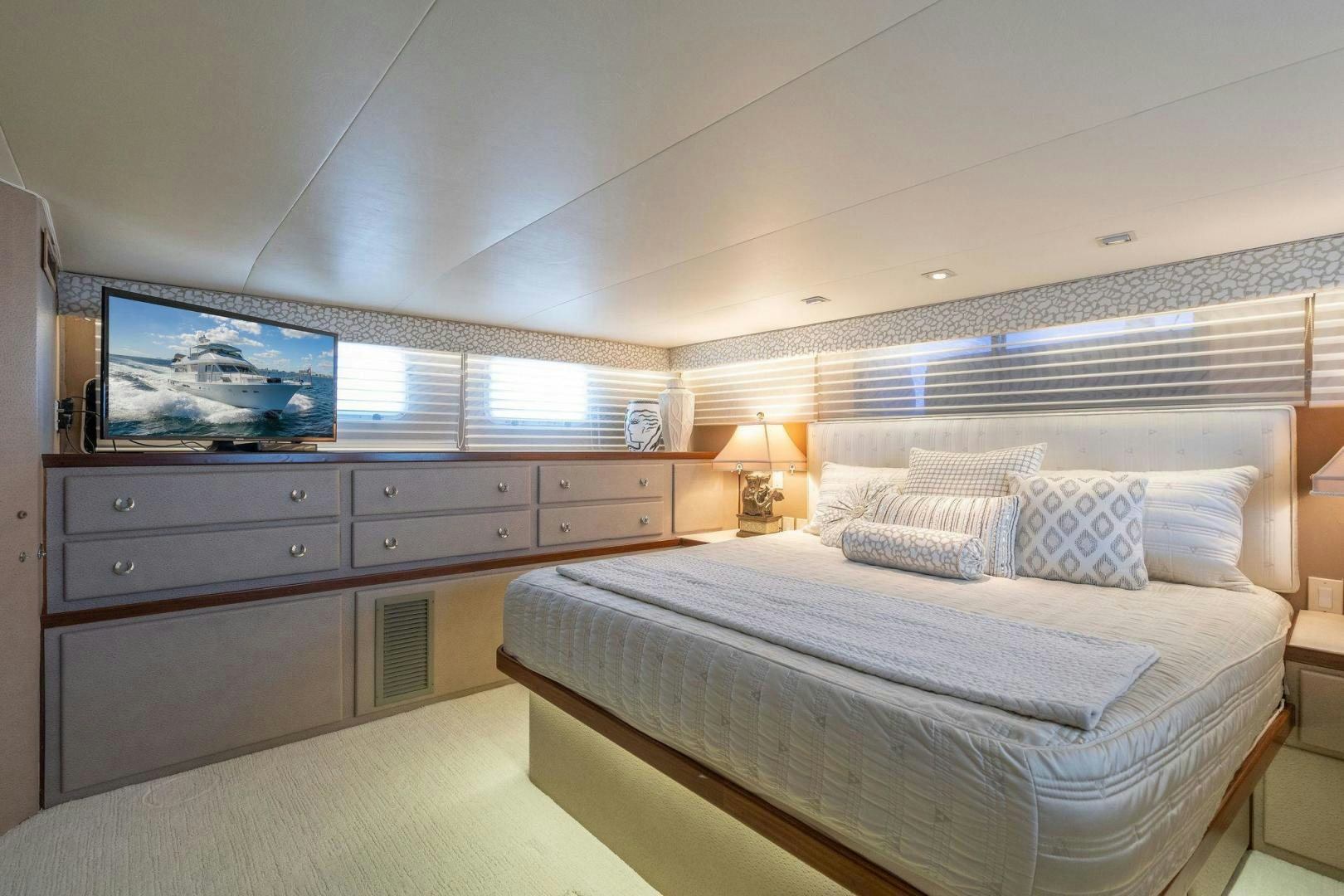 a bedroom with a large bed aboard PEYTONS PLACE Yacht for Sale