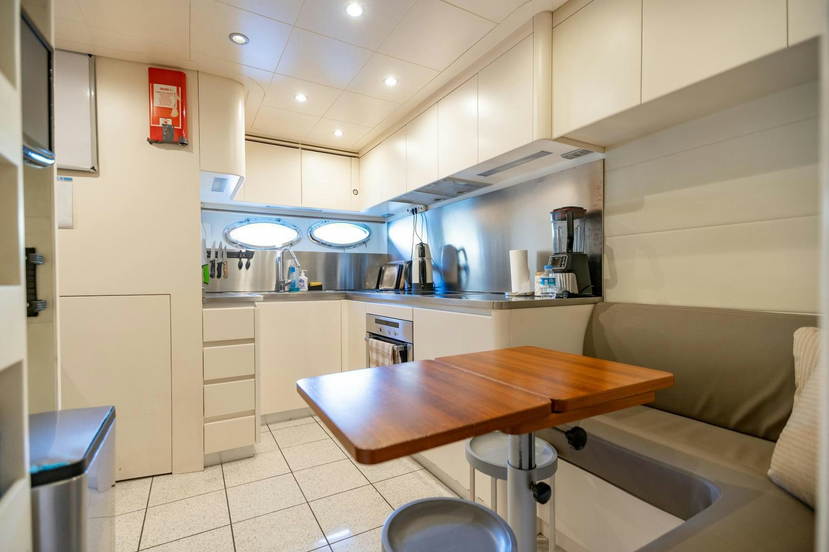 a kitchen with a table and chairs aboard ALYSSA 1 Yacht for Sale