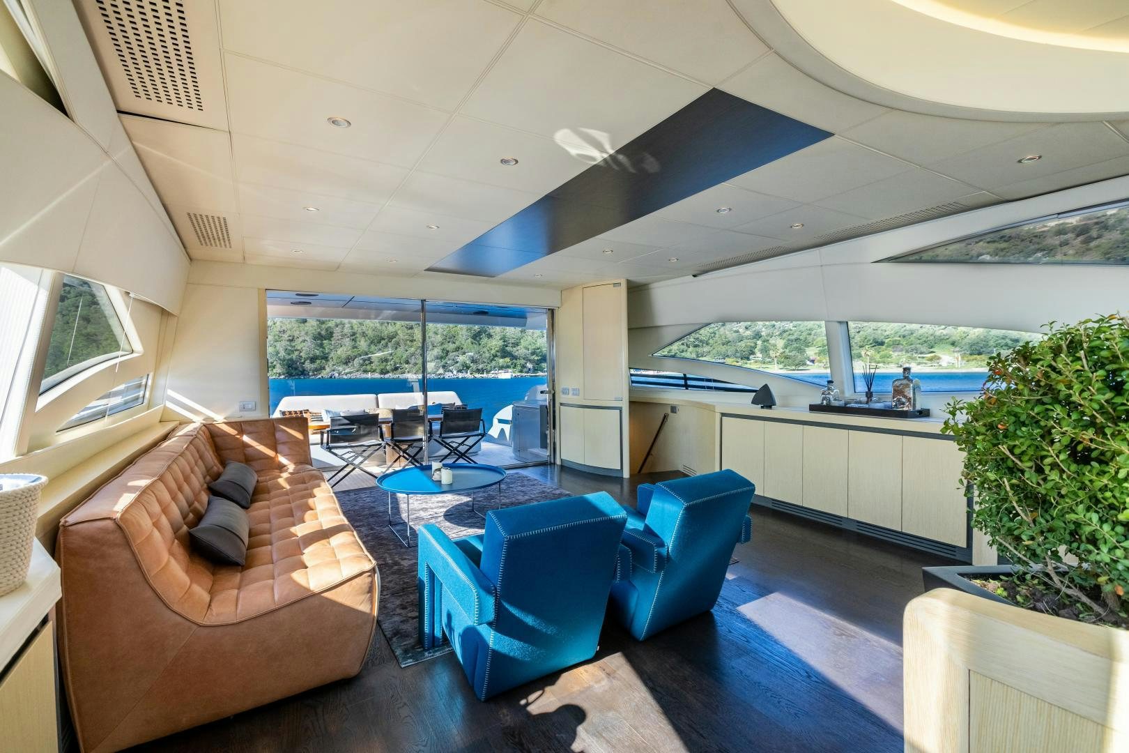 a living room with a large open window aboard ALYSSA 1 Yacht for Sale