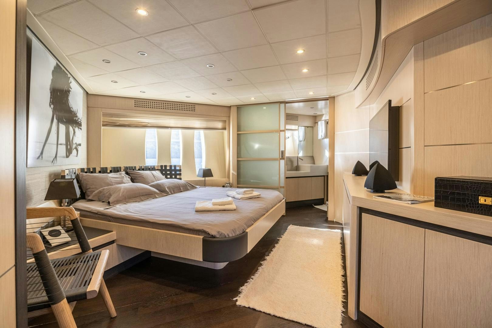 a bedroom with a bed and desk aboard ALYSSA 1 Yacht for Sale