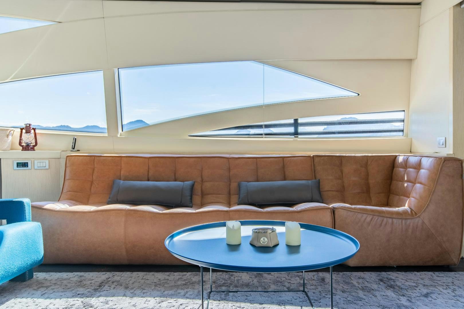 a couch and a coffee table aboard ALYSSA 1 Yacht for Sale