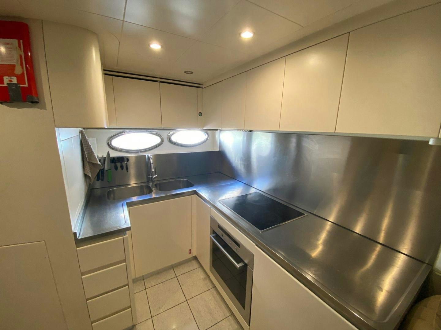 a kitchen with a stove and a microwave aboard ALYSSA 1 Yacht for Sale