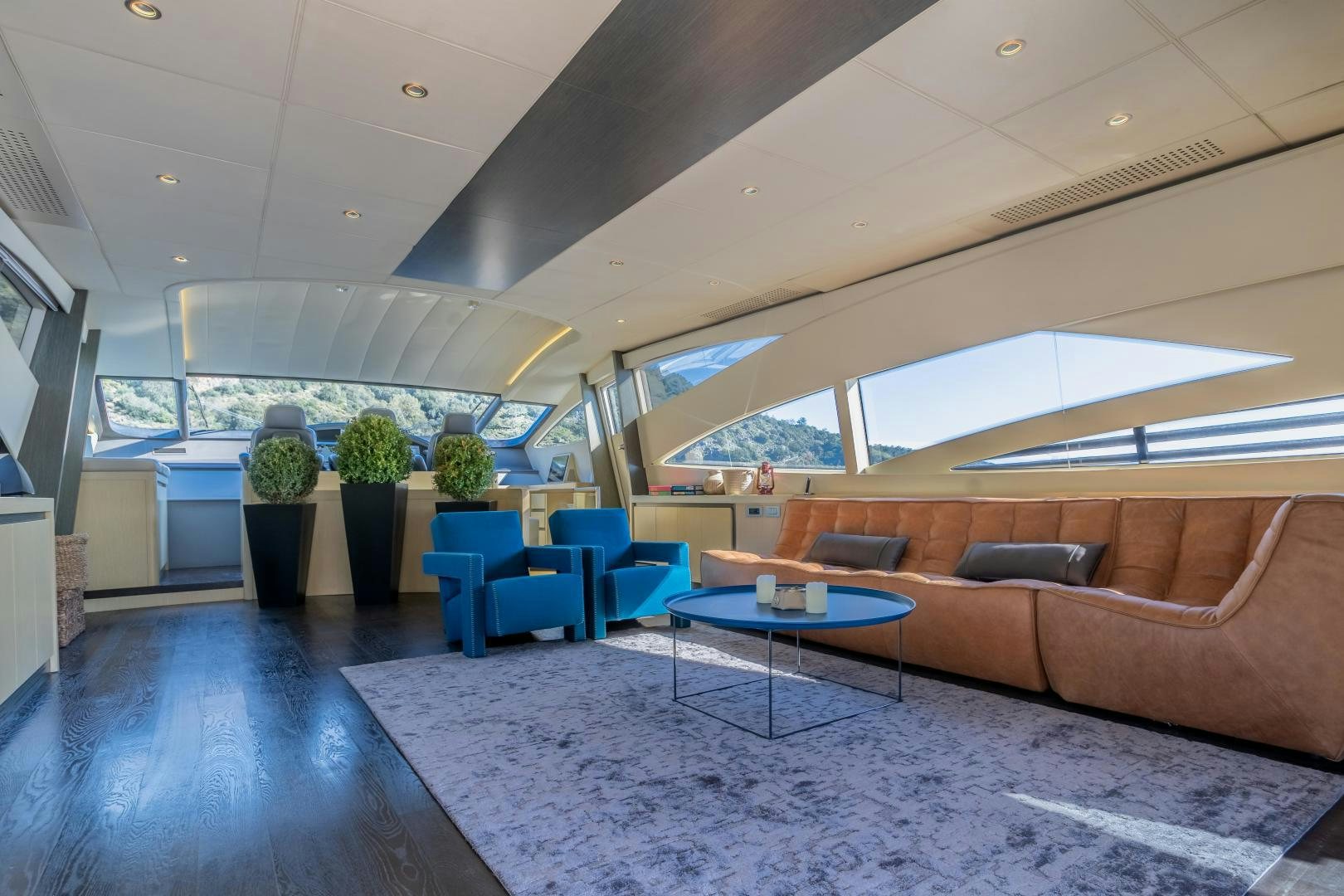 a living room with a couch and a table aboard ALYSSA 1 Yacht for Sale