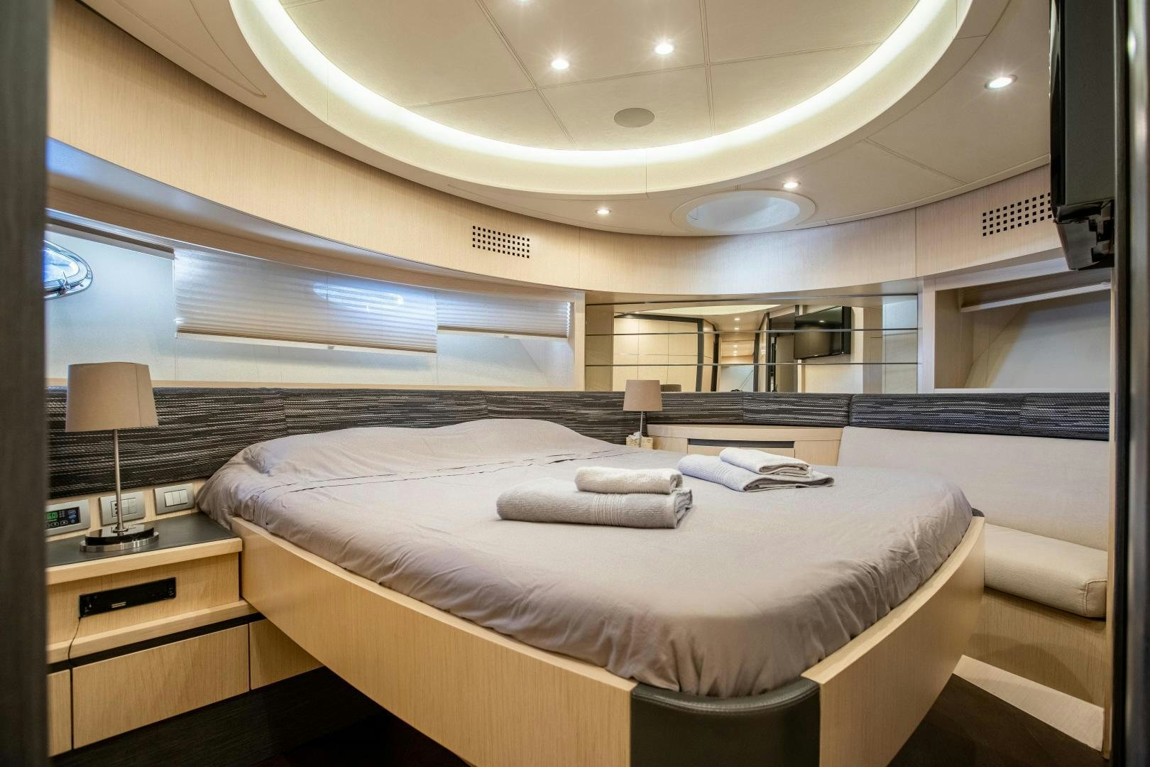 a room with a bed and a lamp aboard ALYSSA 1 Yacht for Sale