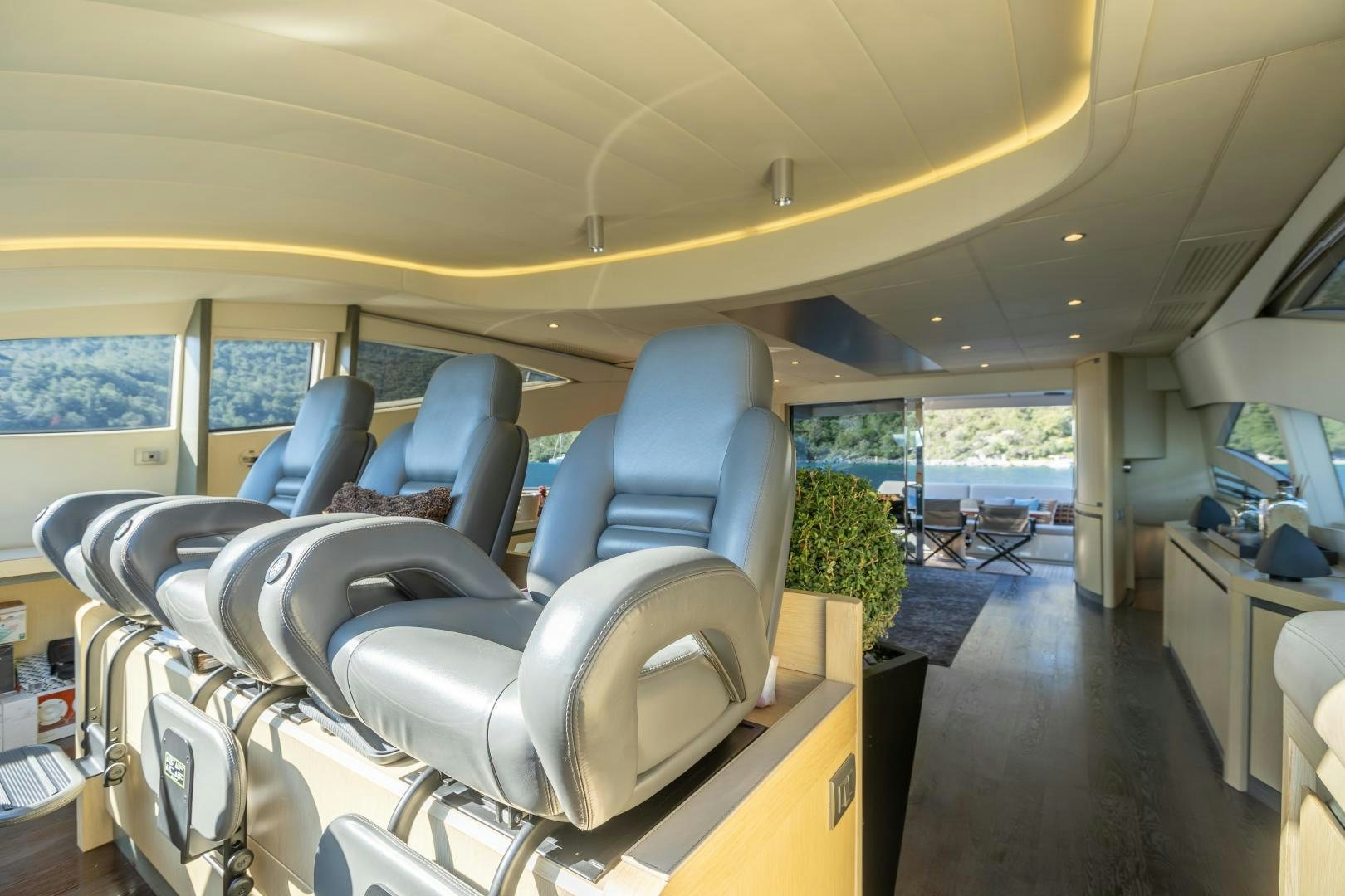 inside of a vehicle with chairs and tables and plants aboard ALYSSA 1 Yacht for Sale
