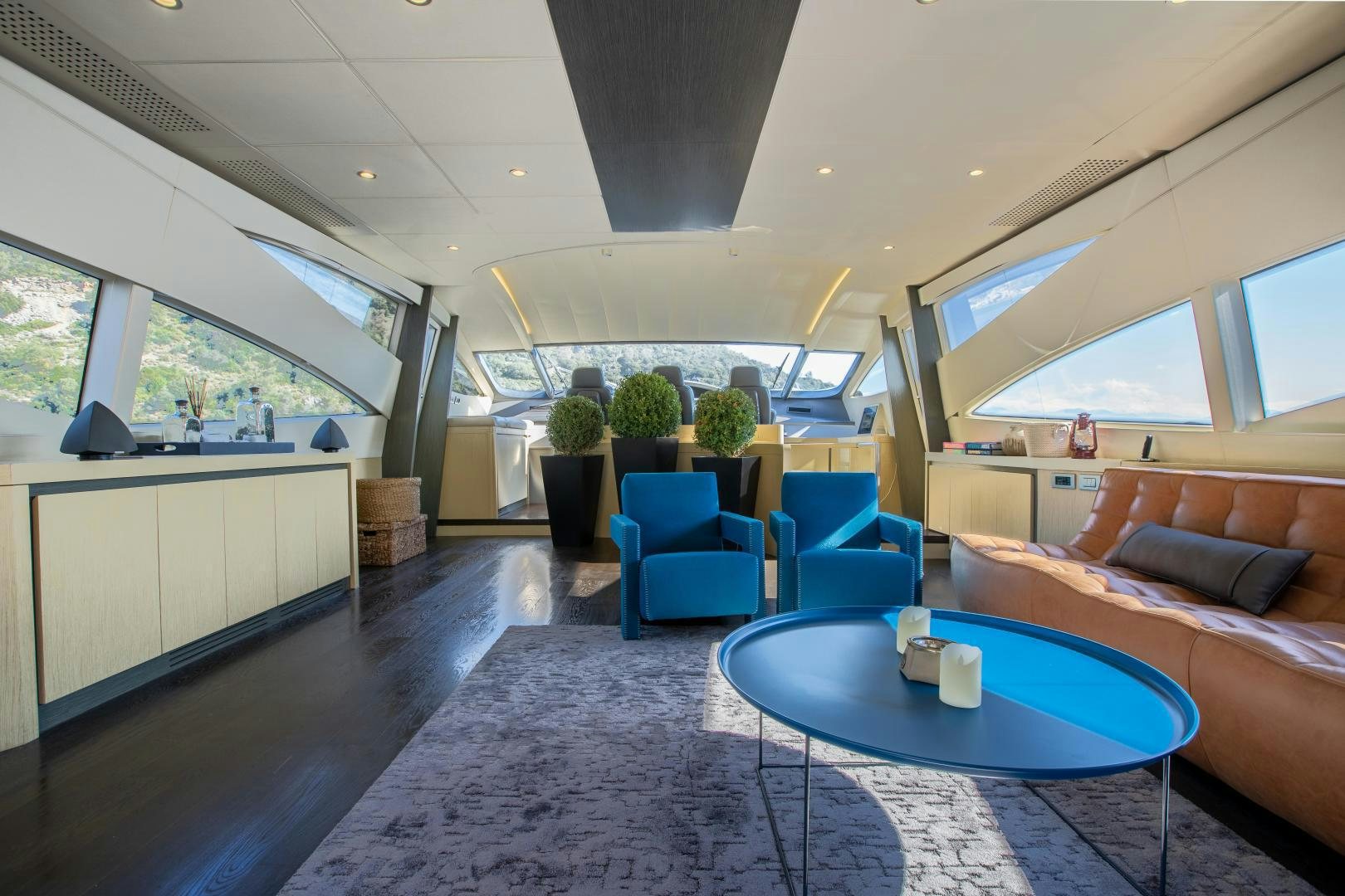 a living room with a couch and a table aboard ALYSSA 1 Yacht for Sale