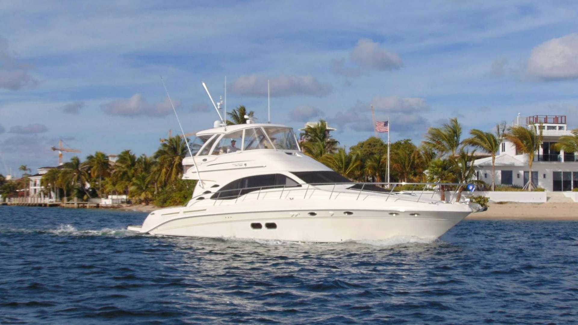 a white yacht in the water aboard GINA LOUISE Yacht for Sale