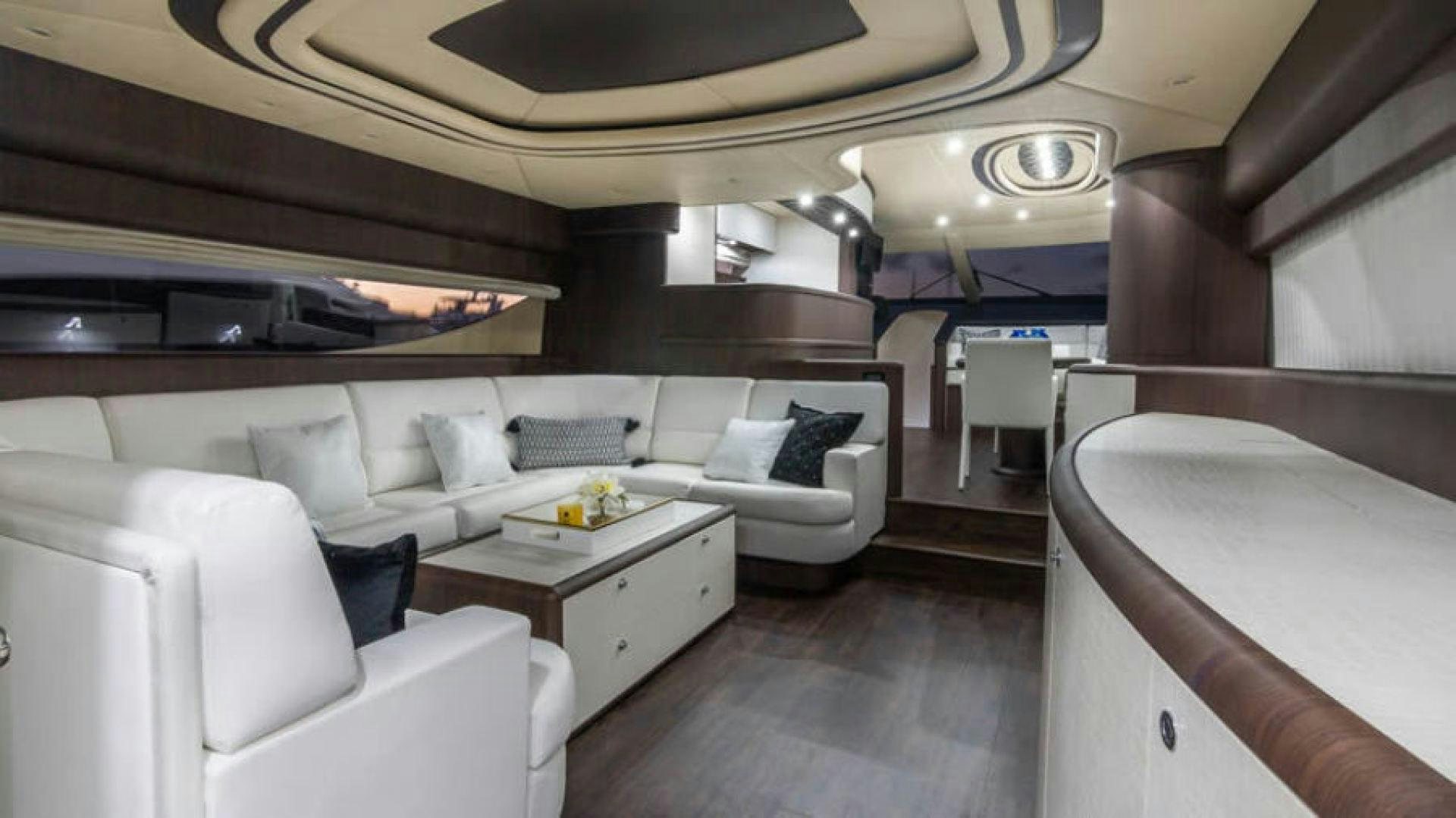 a room with a couch and a table aboard NEXT Yacht for Sale