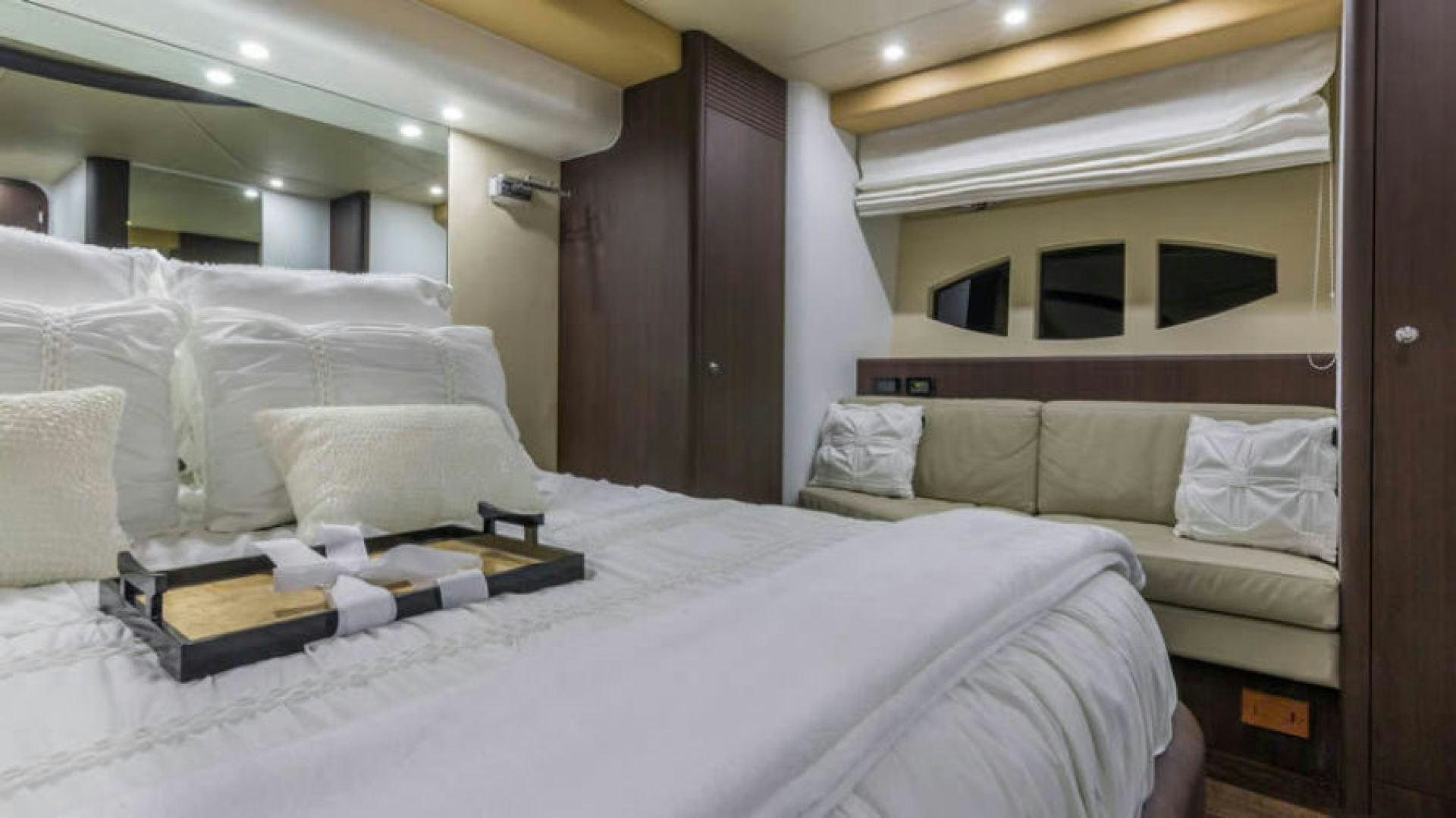 a room with a bed and a desk aboard NEXT Yacht for Sale