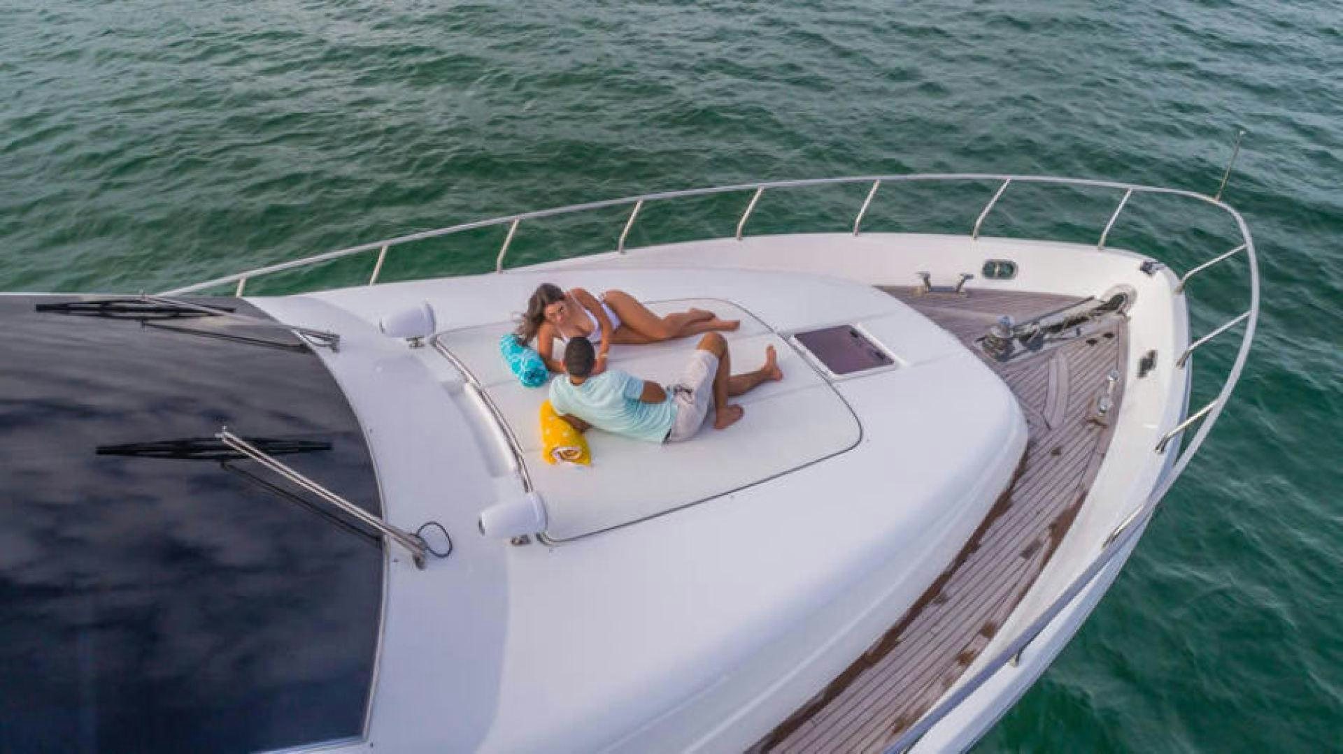 a man and a woman on a boat in the water aboard NEXT Yacht for Sale