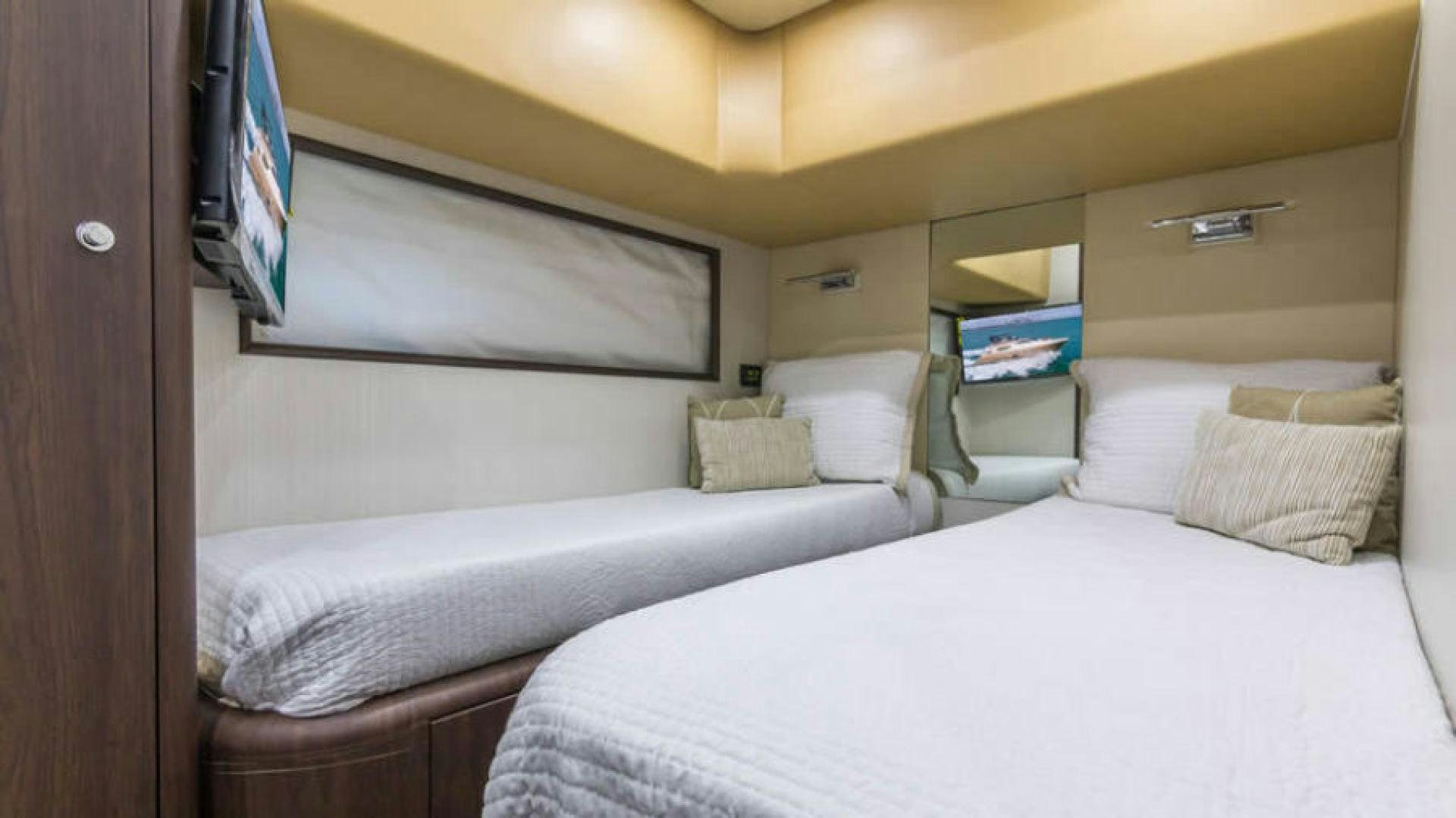 a room with two beds aboard NEXT Yacht for Sale